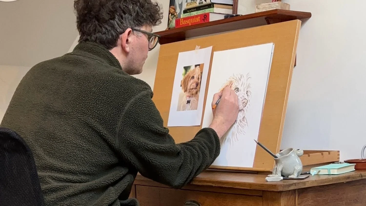 Pet portrait artist Jonny Atkinson drawing a coloured pencil pet portrait