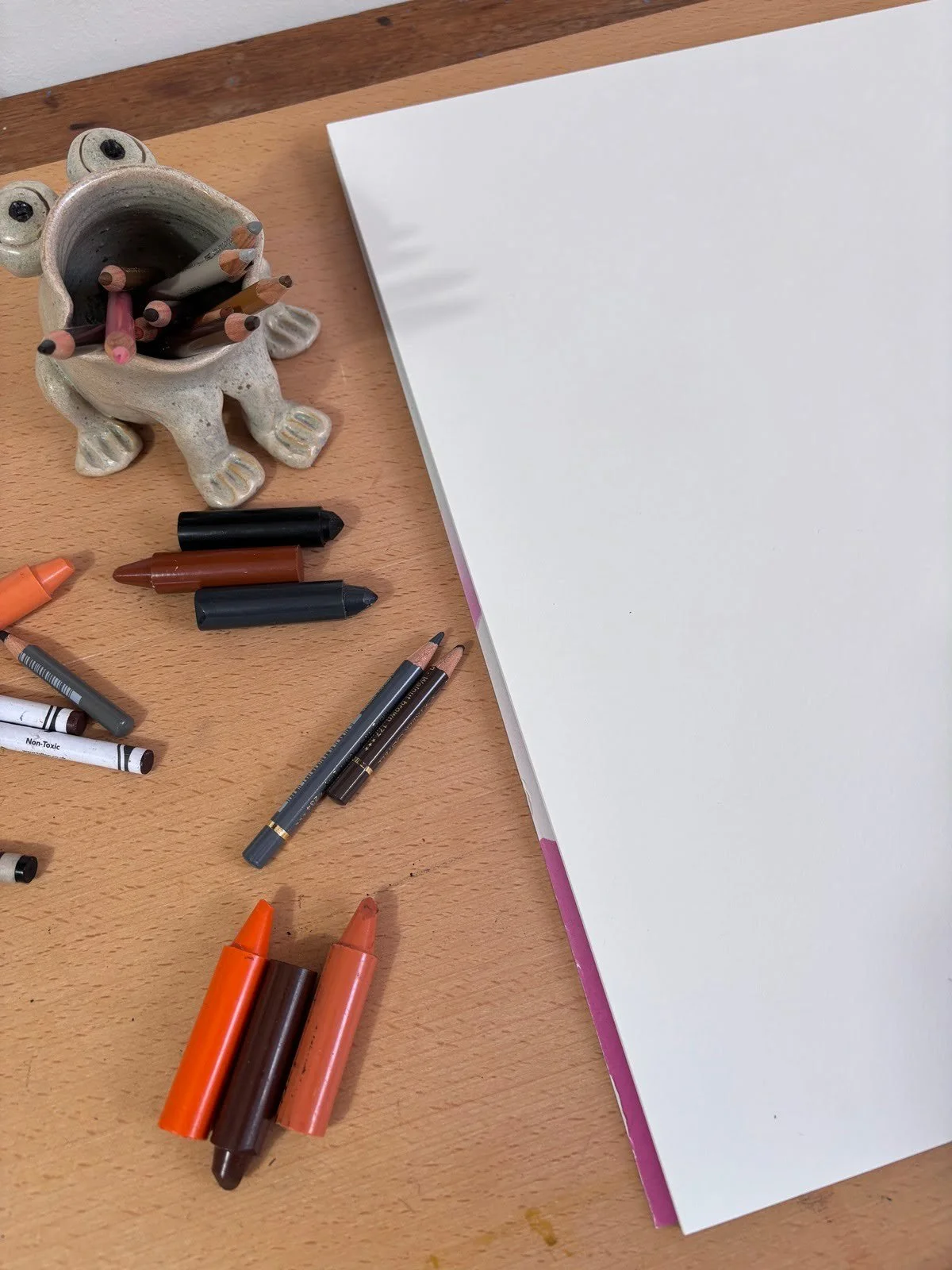 Materials on desk for custom pet portrait