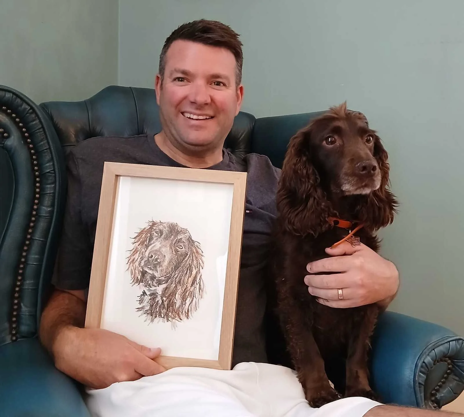 Neil and Star eith their custom hand-drawn pet portrait from photo