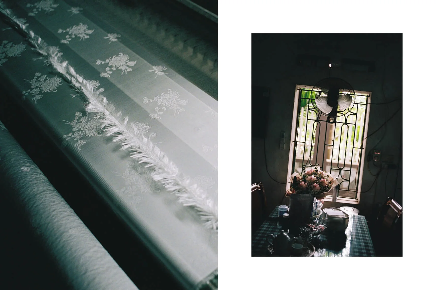 Left side: a roll of white embroidered lace fabric with floral patterns, placed on a flat surface. Right side: a dining room with a table set with dishes, a bouquet of pink and white flowers, and a window with security bars and a ceiling fan above.