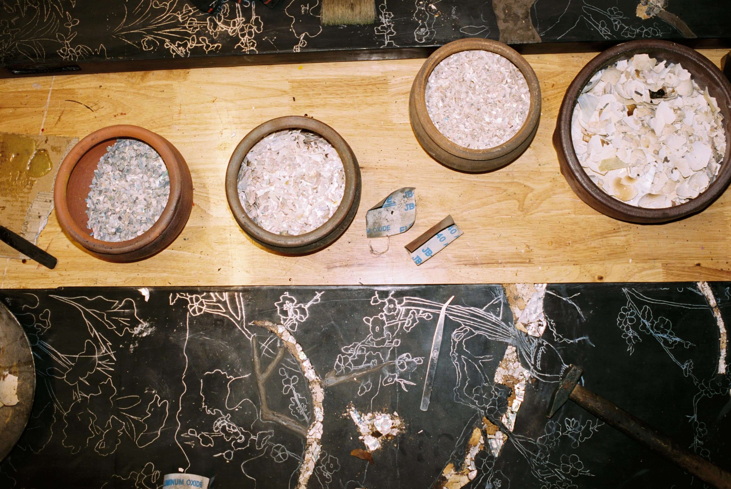nacre artwork in the making with mother of pearl shells and eggshells