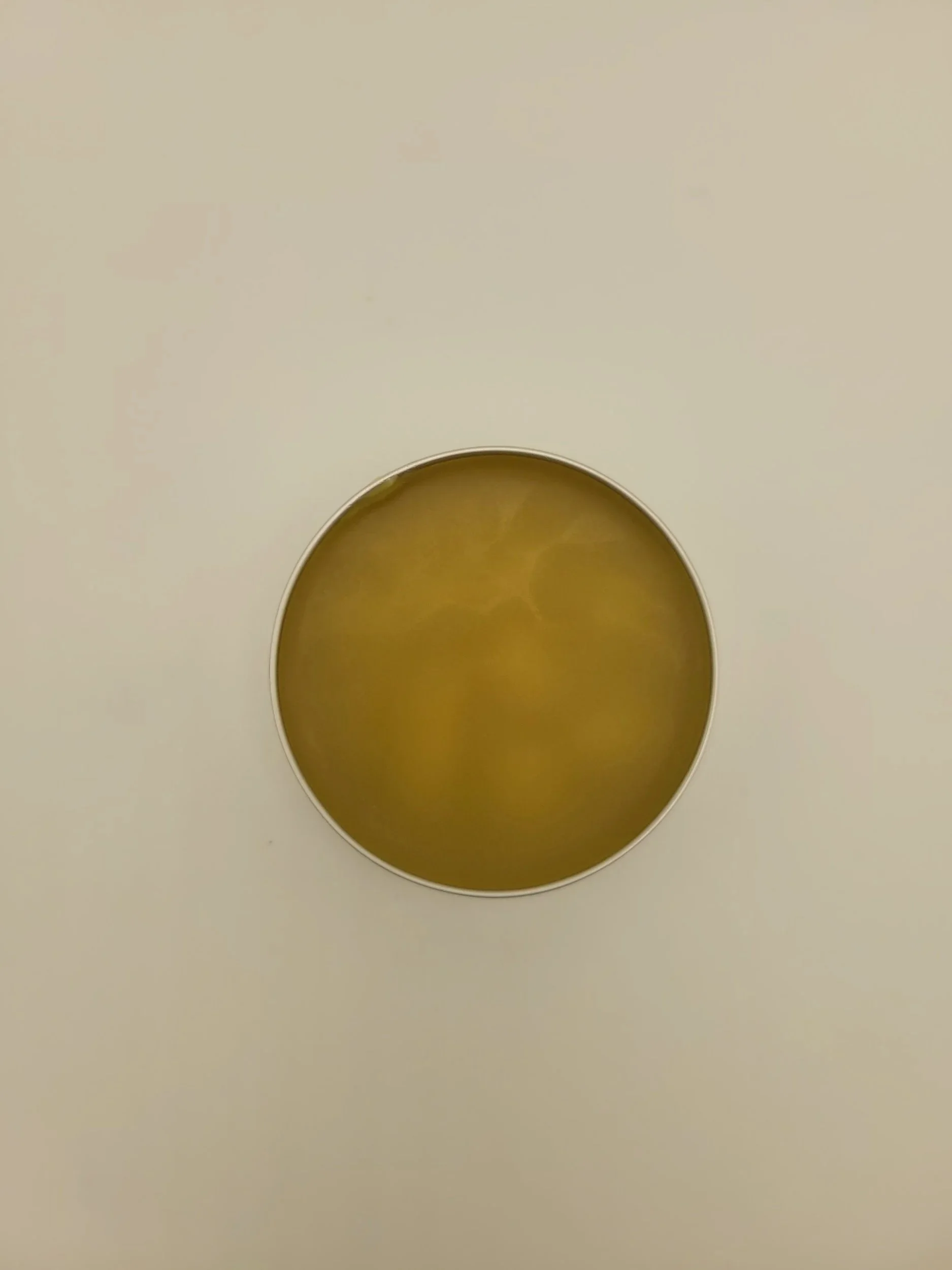 Scratch and Scrape Salve inside showing Yellow salve 2 Oz