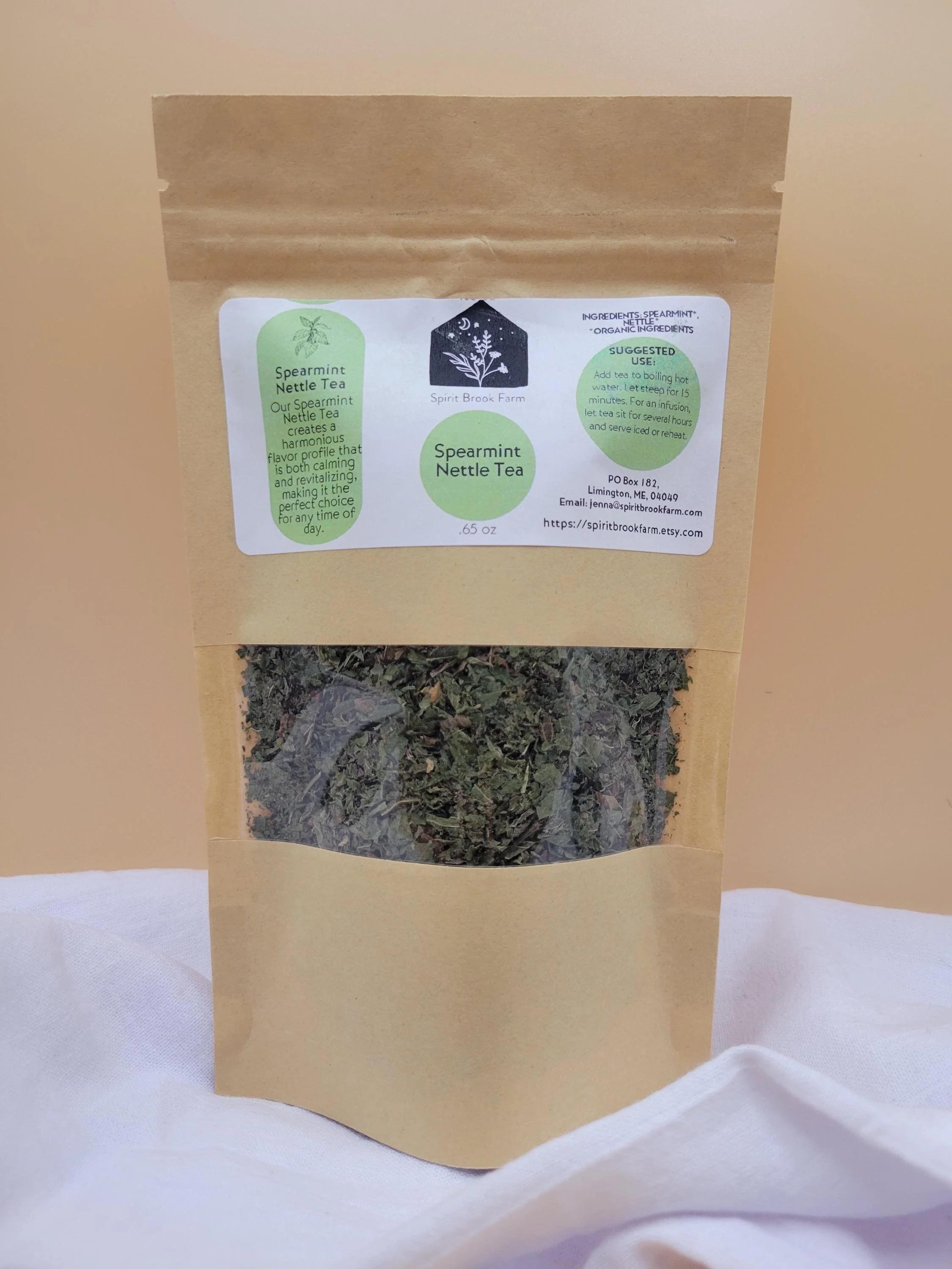 .75 oz spearmint nettle tea in front of brown background