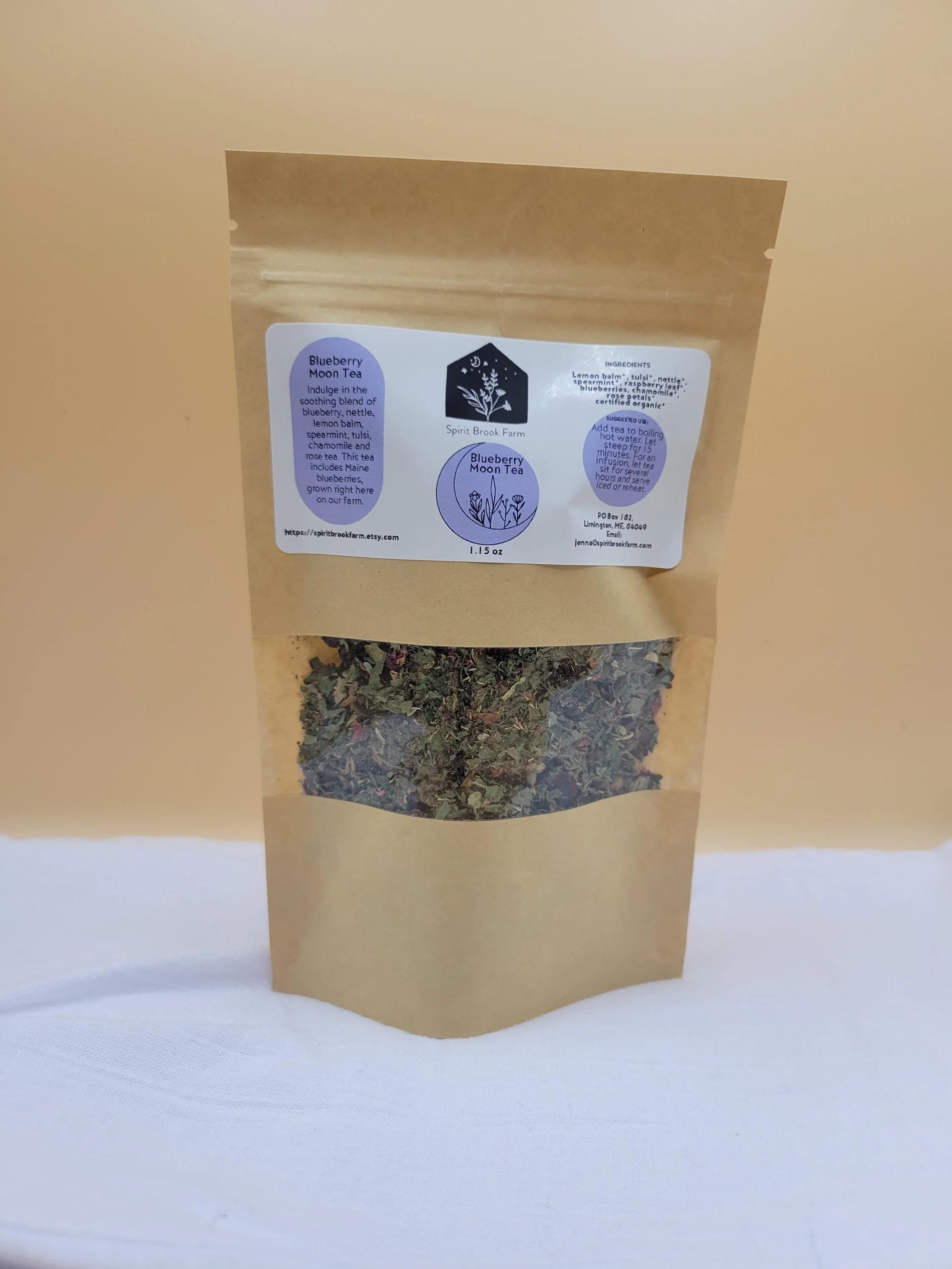 blueberry moon tea in front of brown background