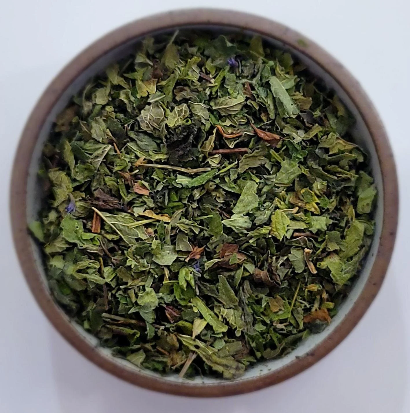 cough and cold loose leaf herbal tea in .75 oz bag in front of brown background