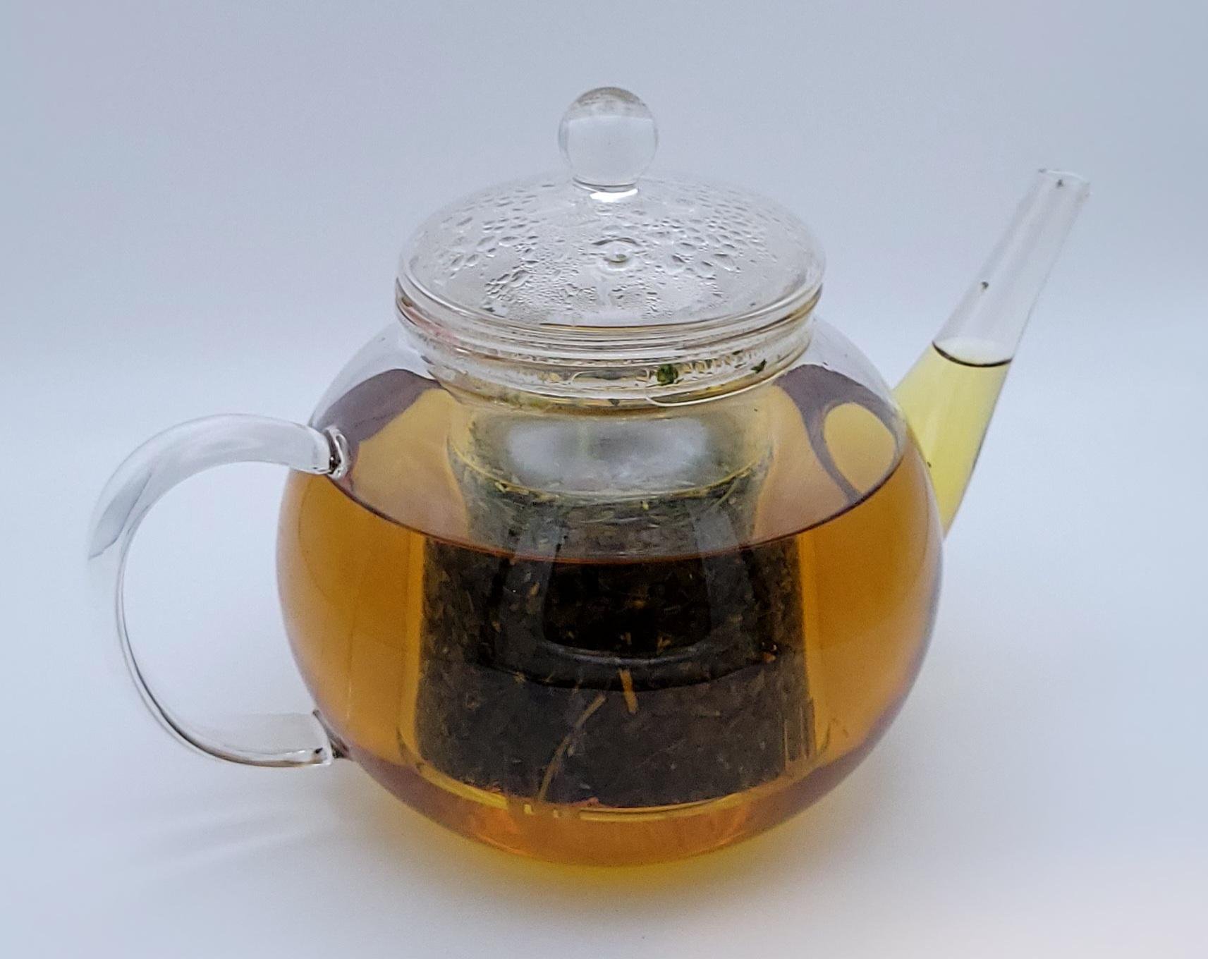 cough and cold herbal tea in clear teapot