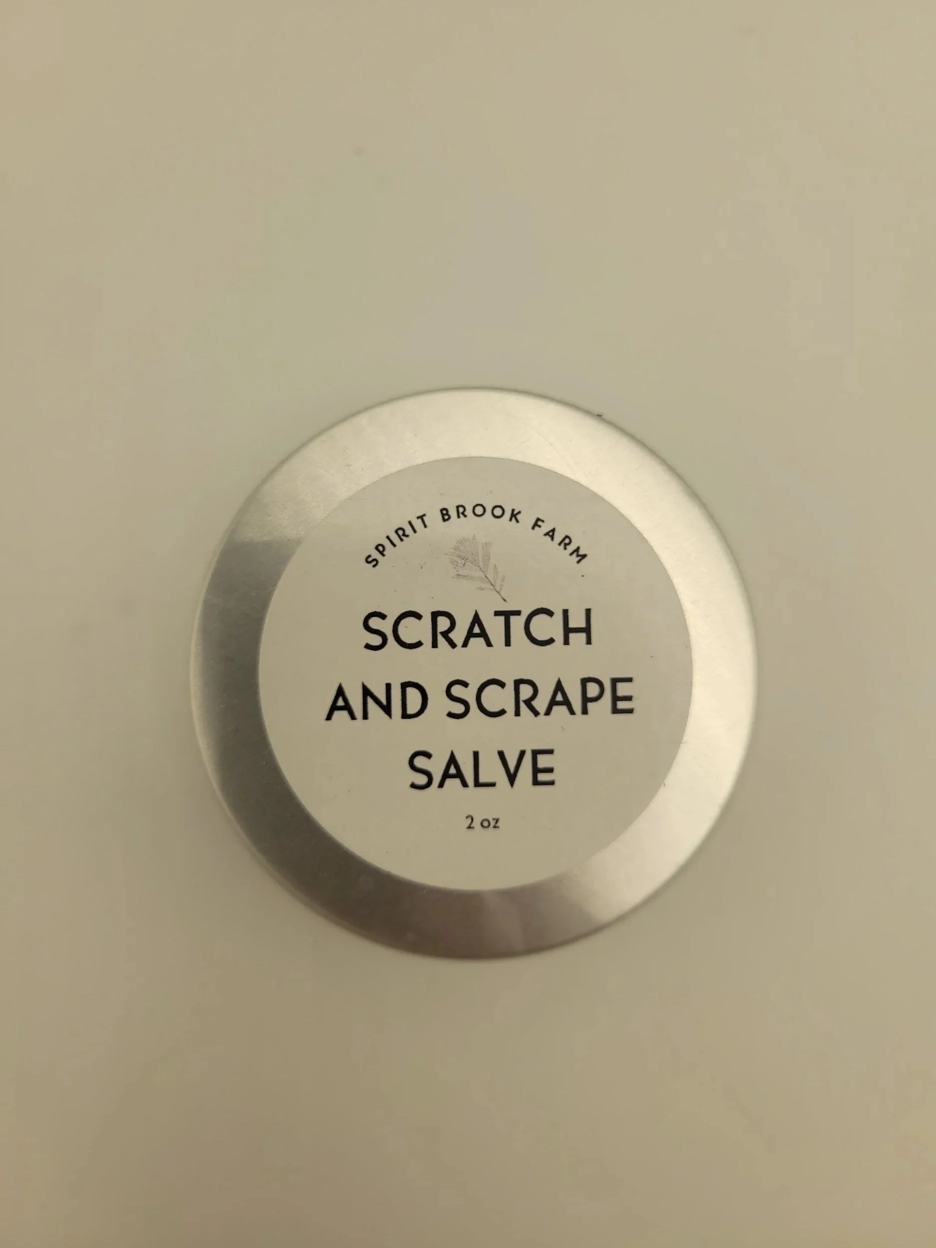 Scratch and Scrape Salve Front in 2 Oz tin