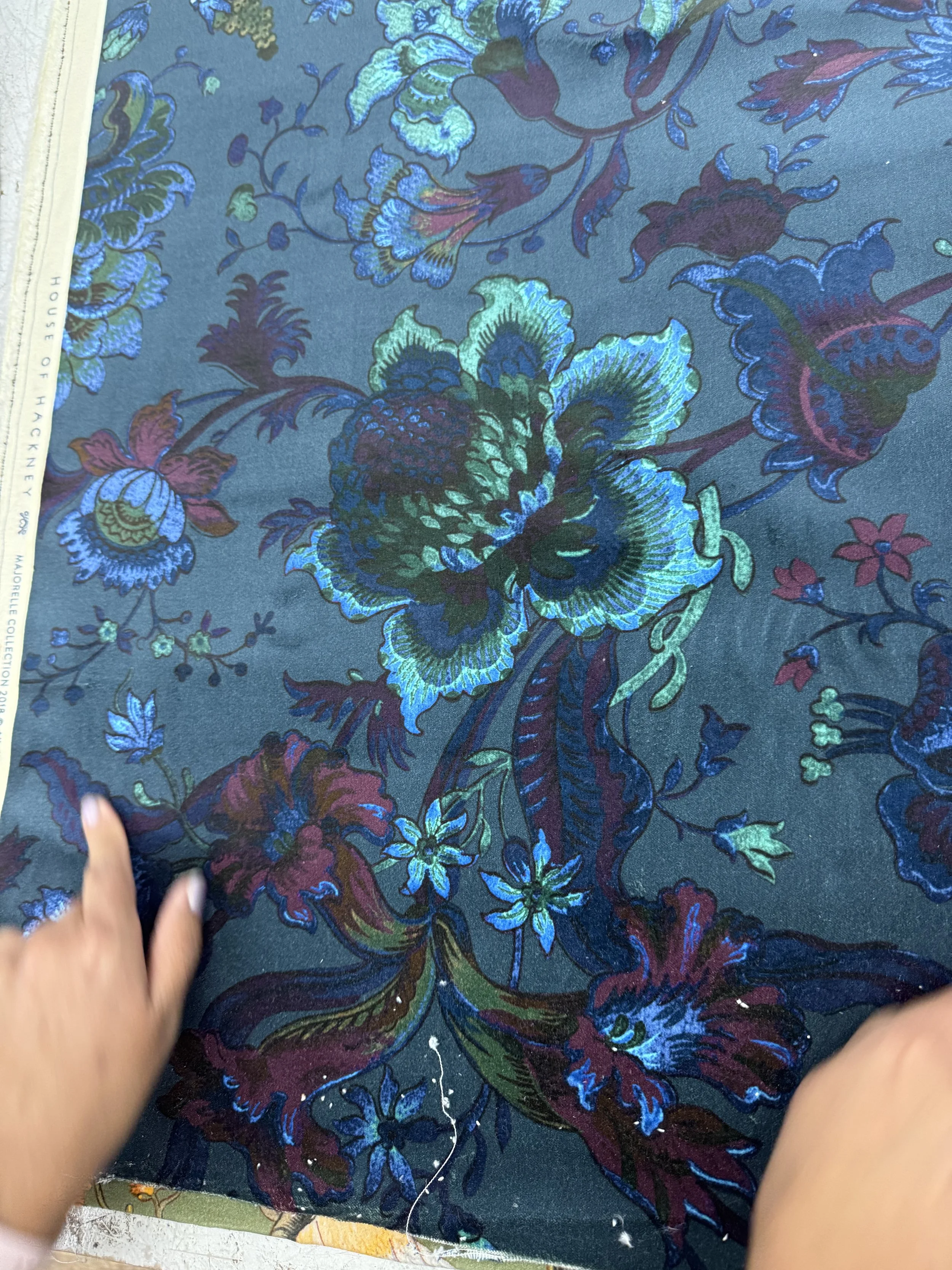 Vibrant floral pattern with working hands