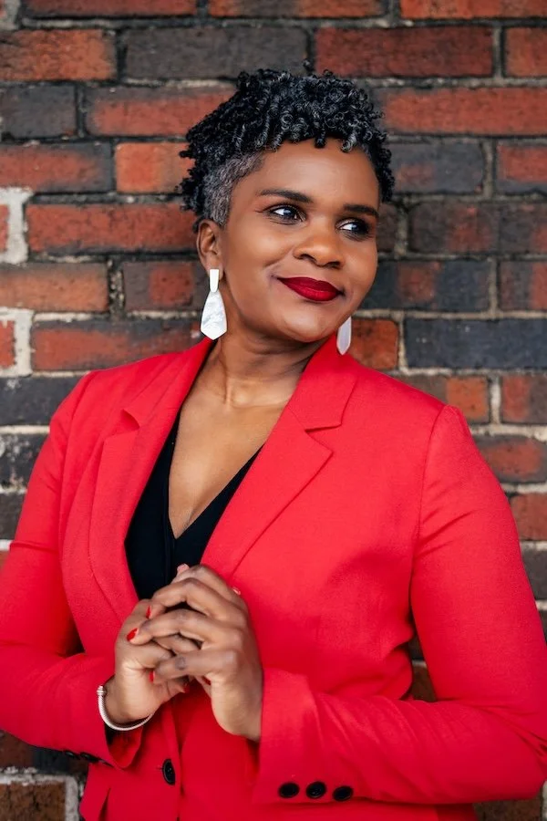 Portrait of Dr. Agena Davenport, board-certified OB-GYN and coach.  Keep