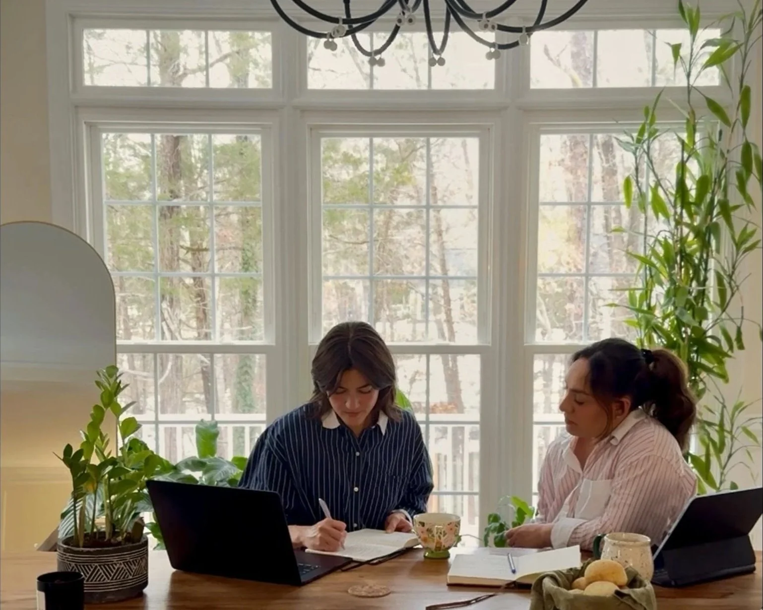 Travel advisors researching and planning customized international itinerary at table