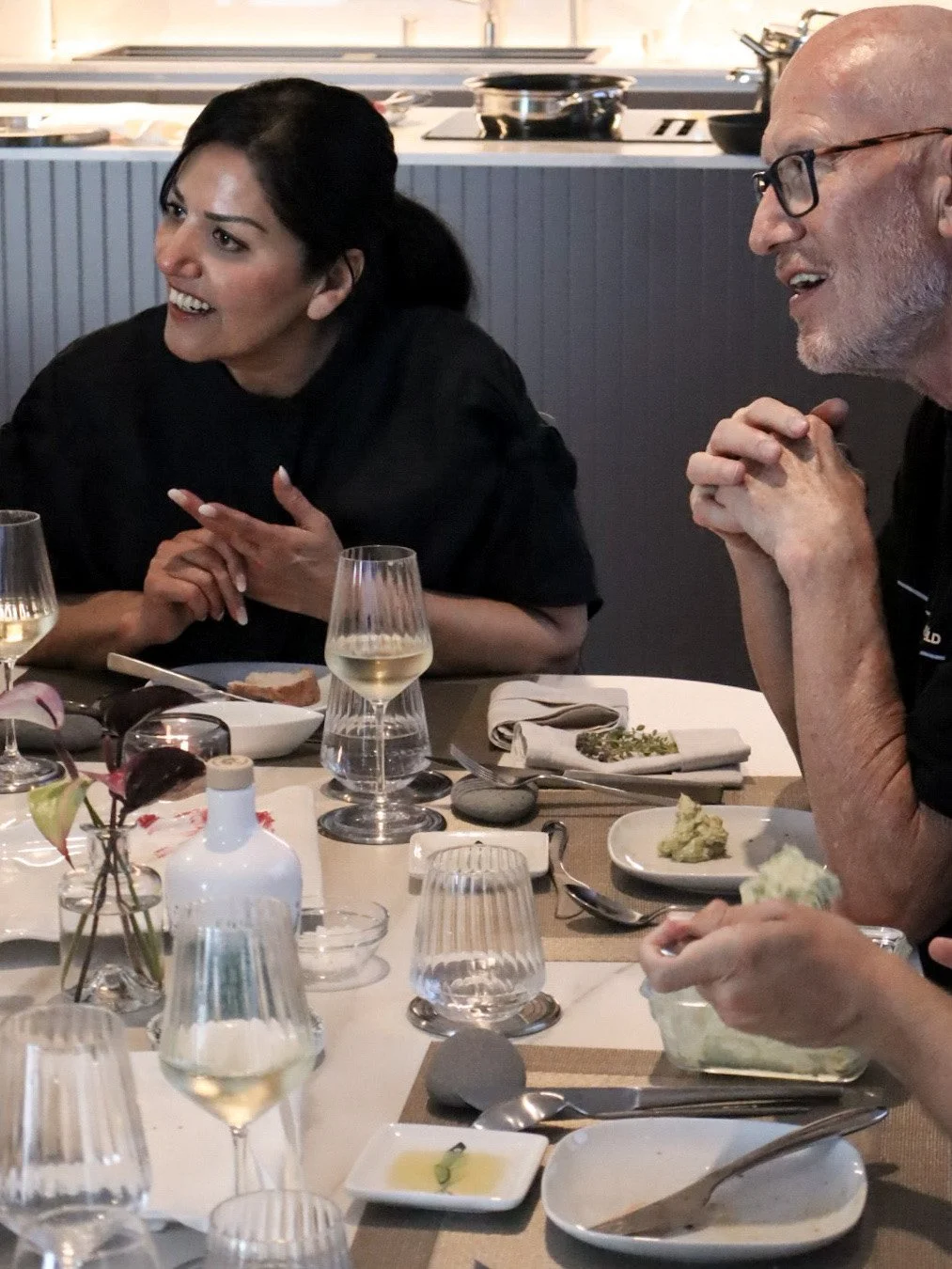 Host Simin talking with guests during a private dining experience on Madeira.