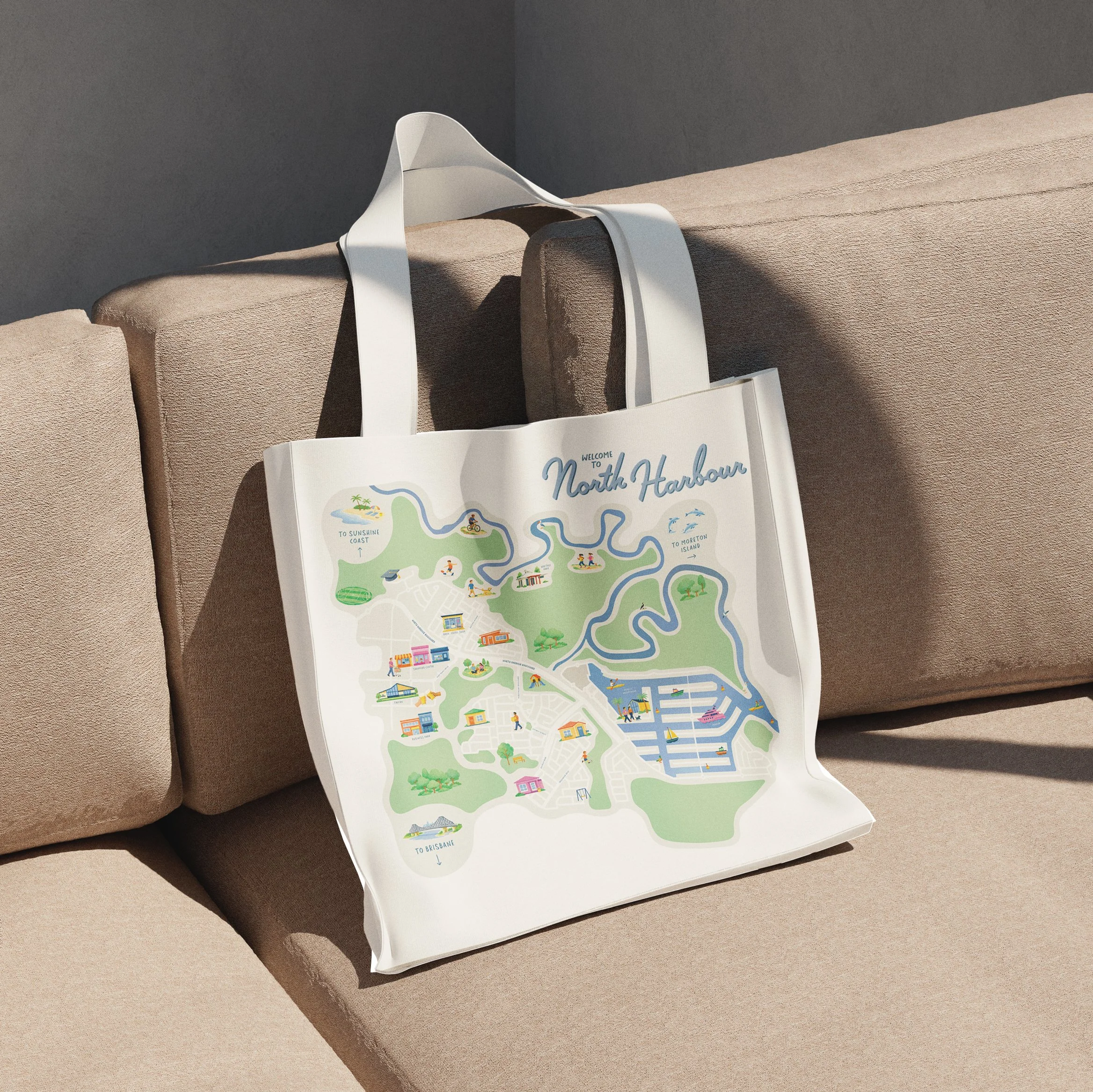 A map of North Harbour with illustrations of local attractions, people, and services, displayed on a table with a Bag nearby.