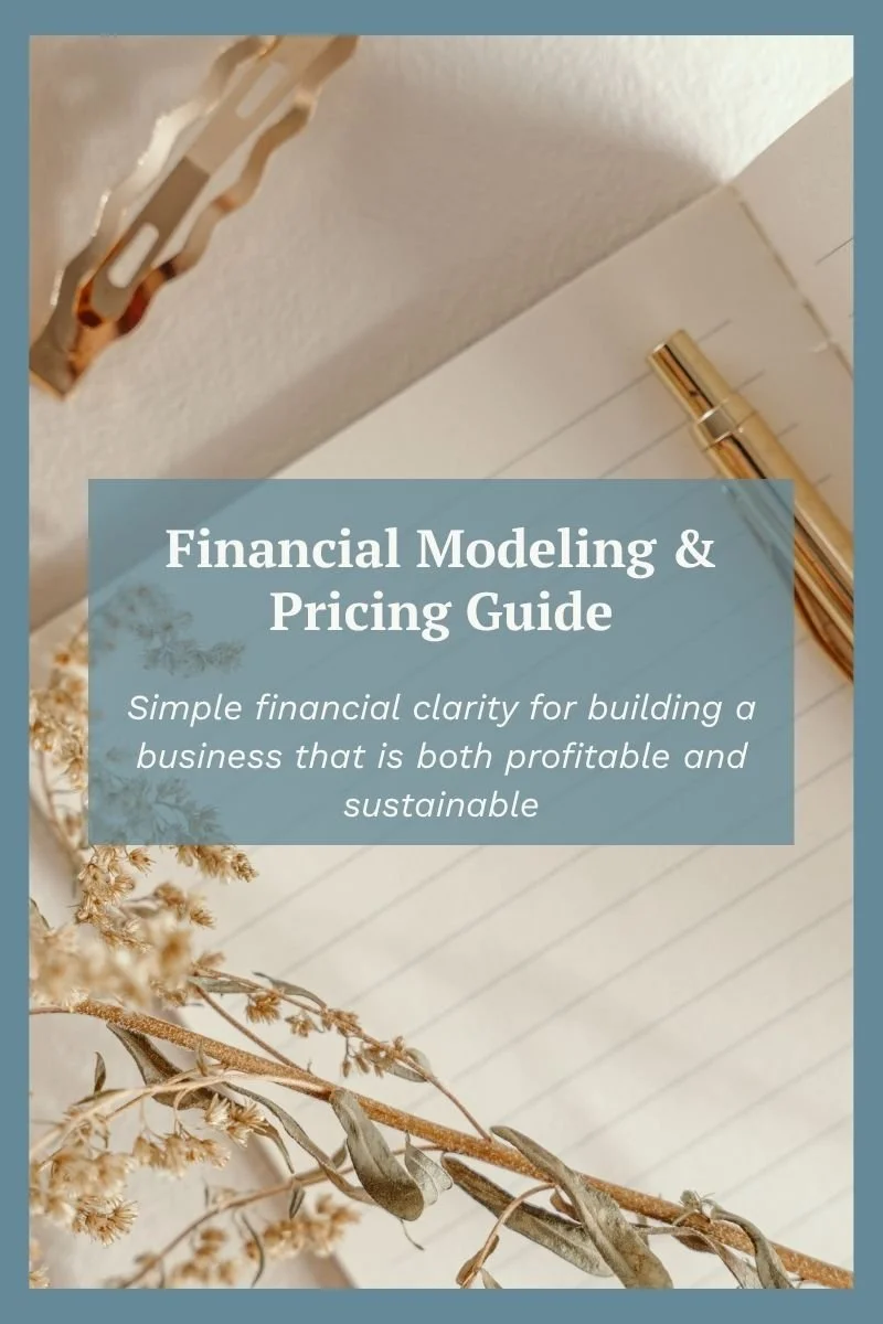 Financial journal with pen and dried flowes