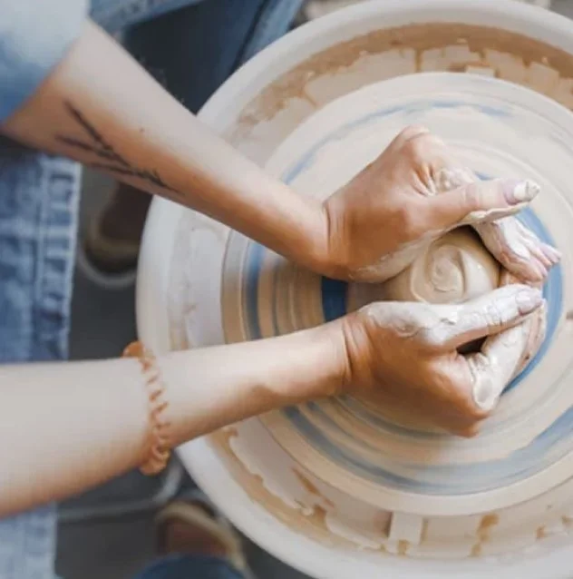 Hands shaping clay on a pottery wheel, symbolizing makers building creative businesses