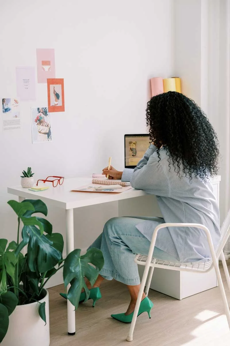 Maker working at a desk, representing foundational support for building a creative business