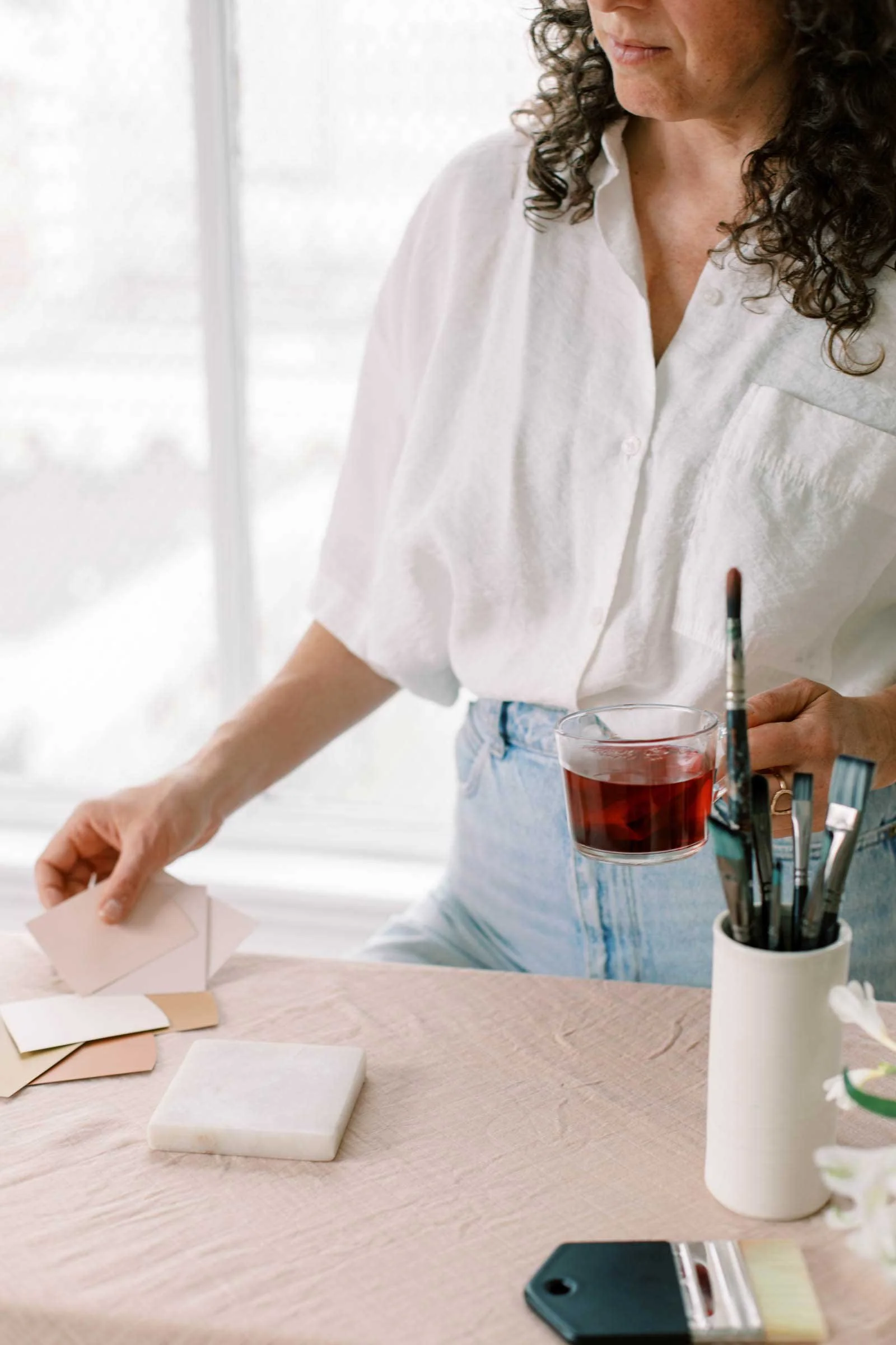 Creative workspace with notes, tools, and materials laid out for business planning