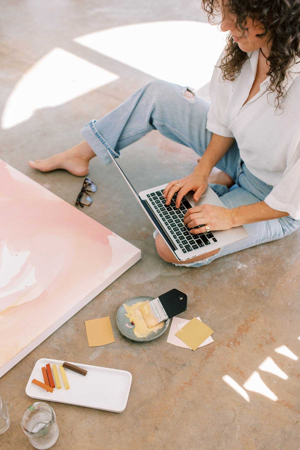 Creative entrepreneur working on a laptop in a calm workspace