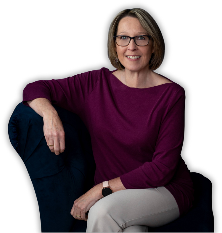 Business coach seated and smiling during a one-on-one coaching session