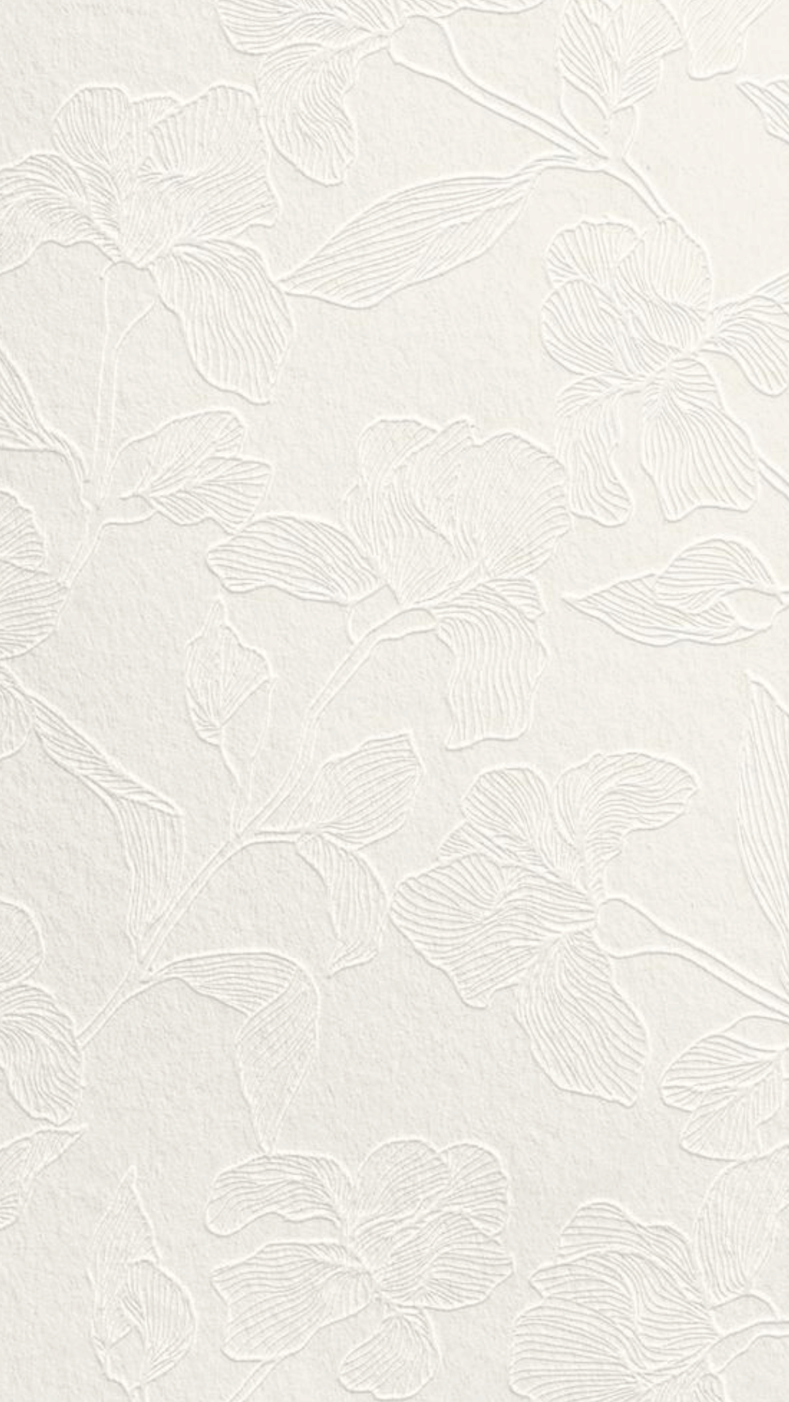 White textured wallpaper with embossed floral pattern of large, flowing leaves and flowers.