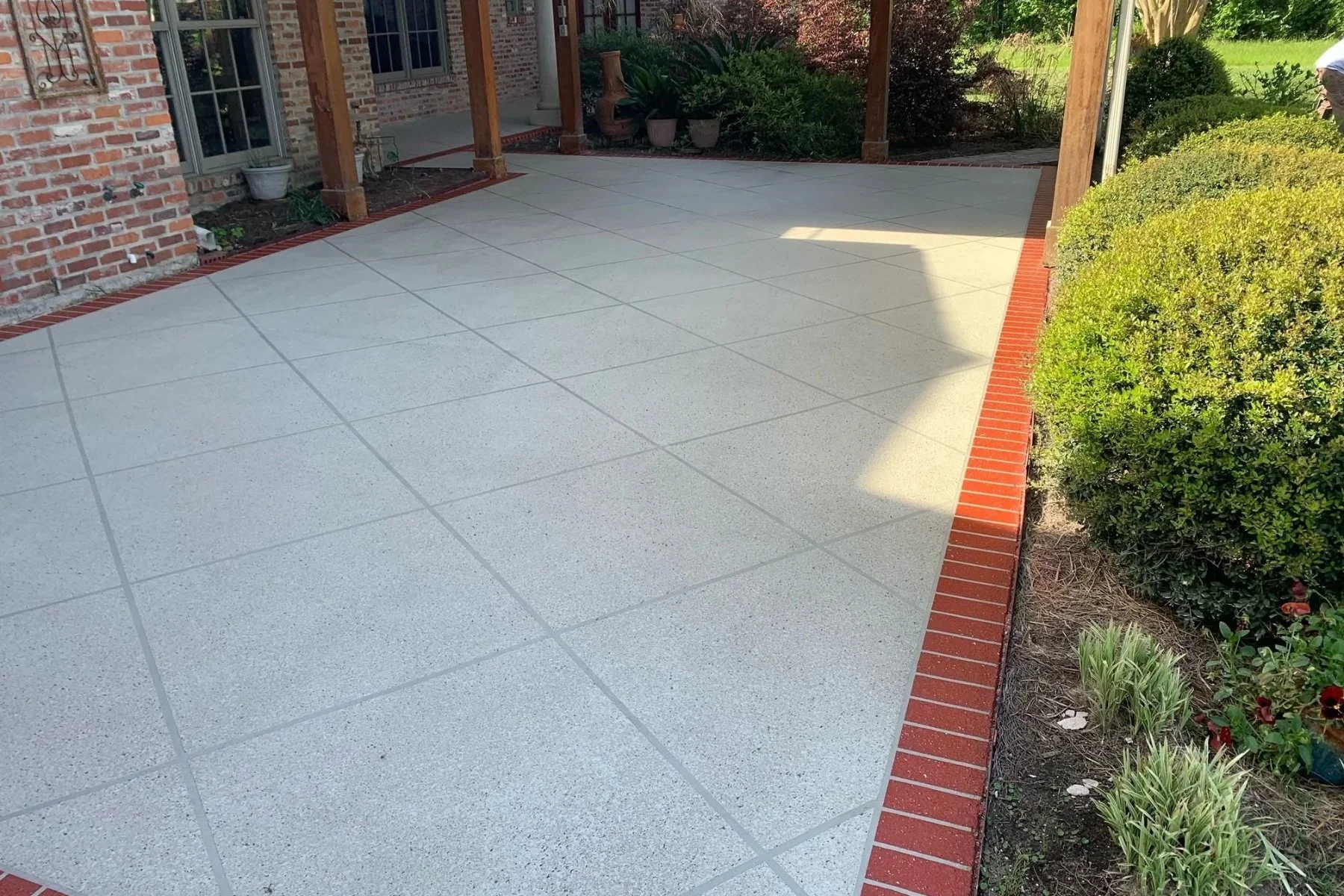 Hallmark System spray texture concrete overlay on a residential patio in South Louisiana