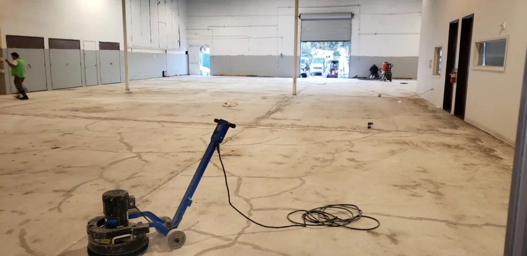 concrete surface being prepped for a decorative overlay