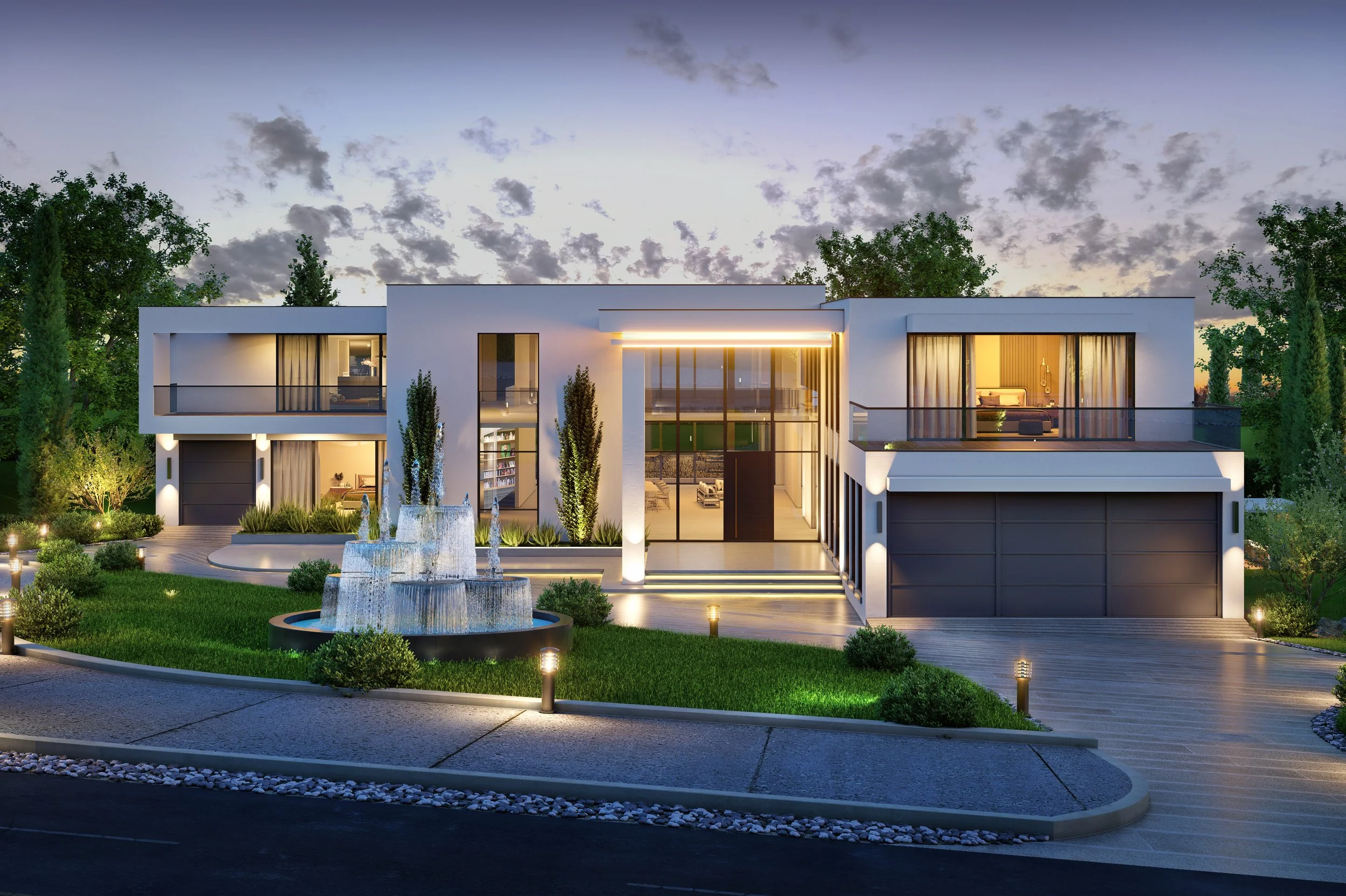 Modern white two-story house with large glass windows, balconies, and a central fountain in the front yard, illuminated by exterior lighting at dusk.