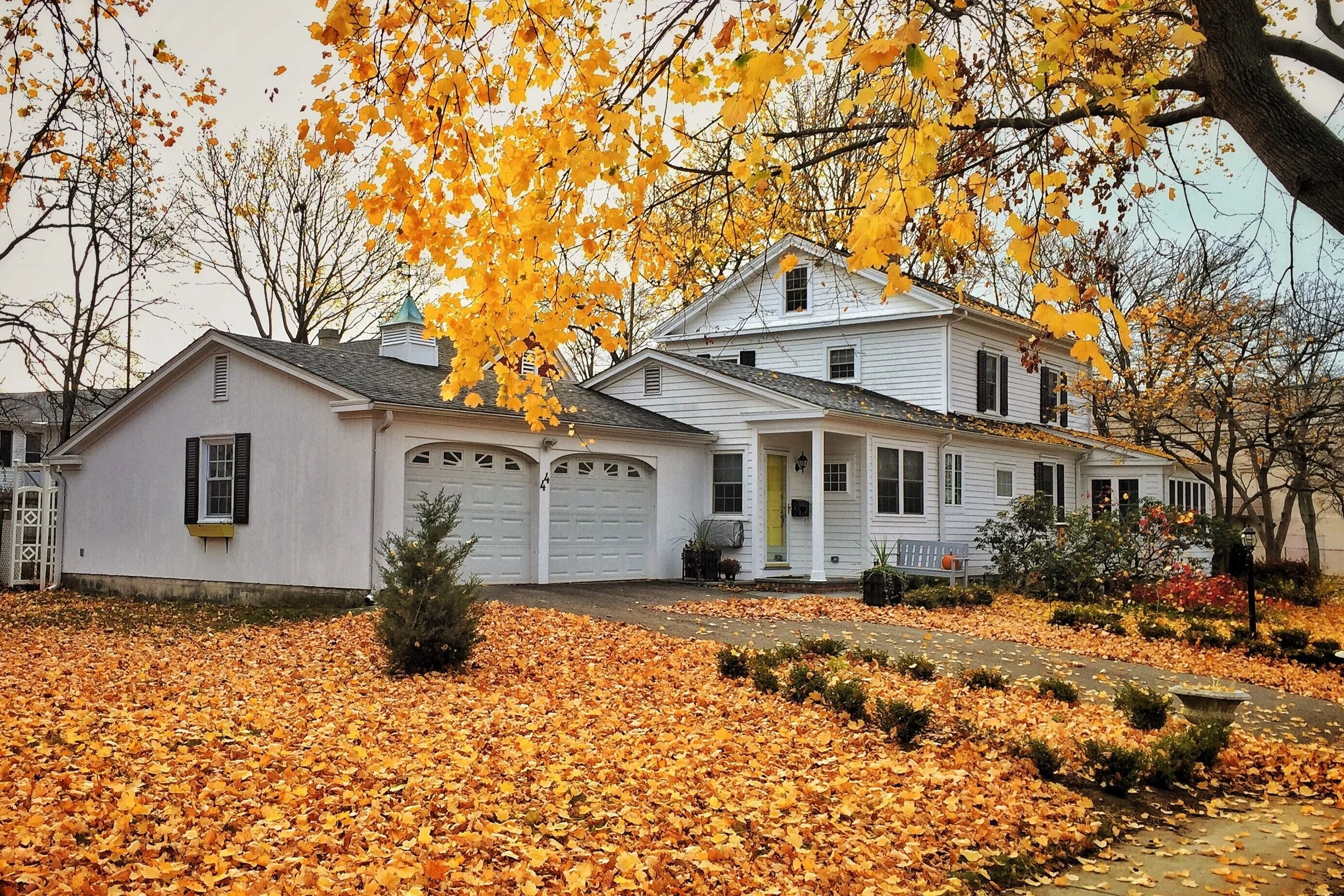 Keeping Your HVAC Unit Running Efficiently Through Debris Buildup, Fall Leaves, and Winter Storms