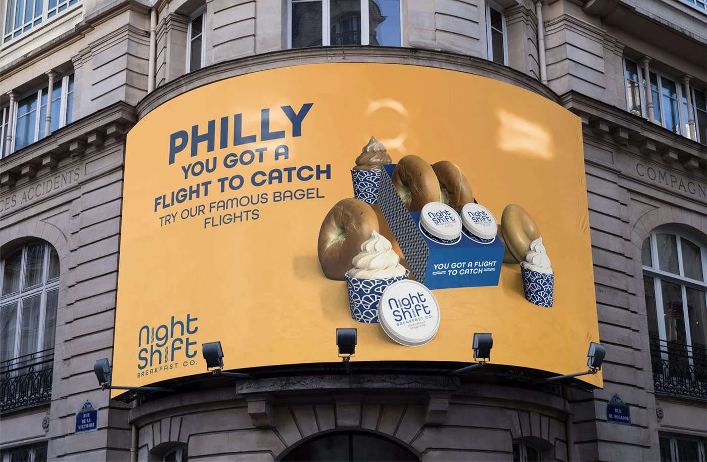 Night Shift Billboard Advertisement Featuring Bagel Flights