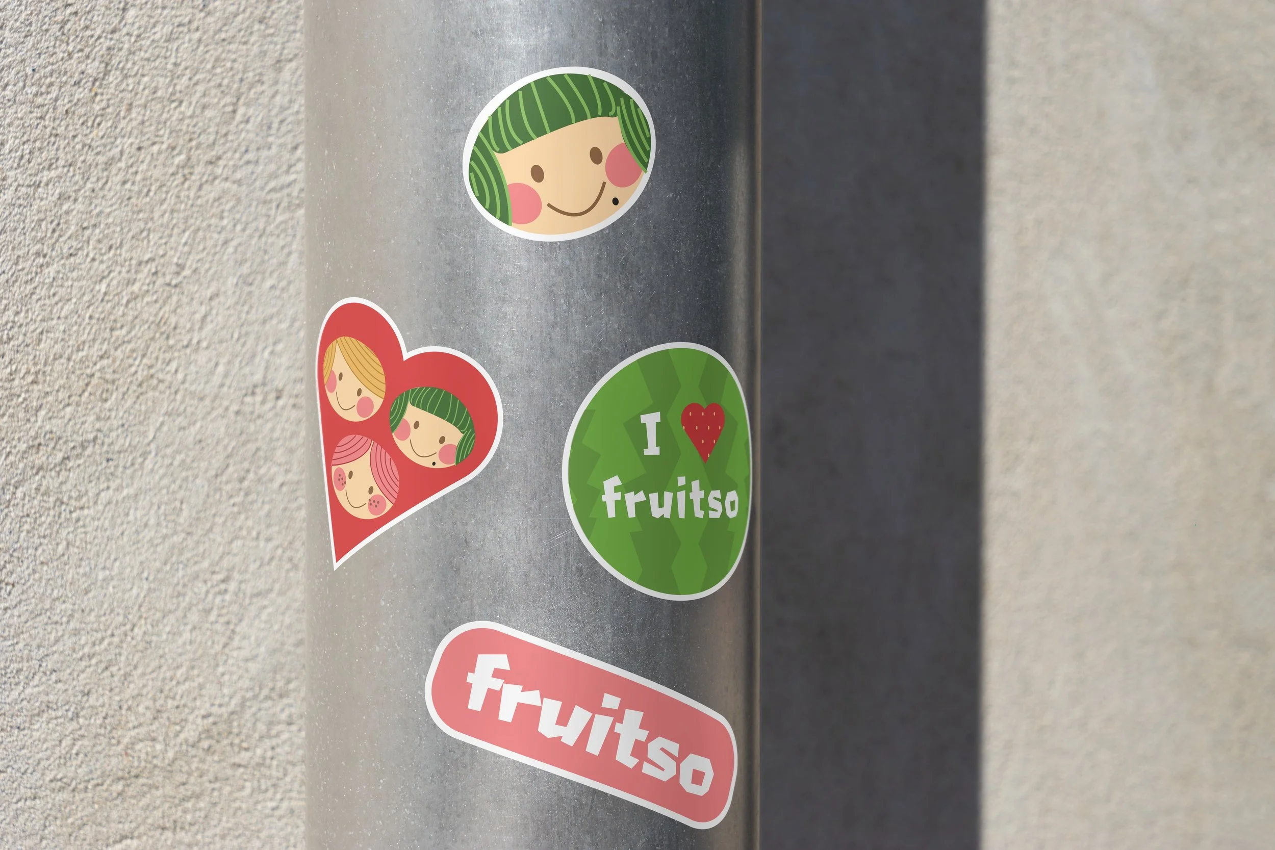 Metal pole with various stickers on it