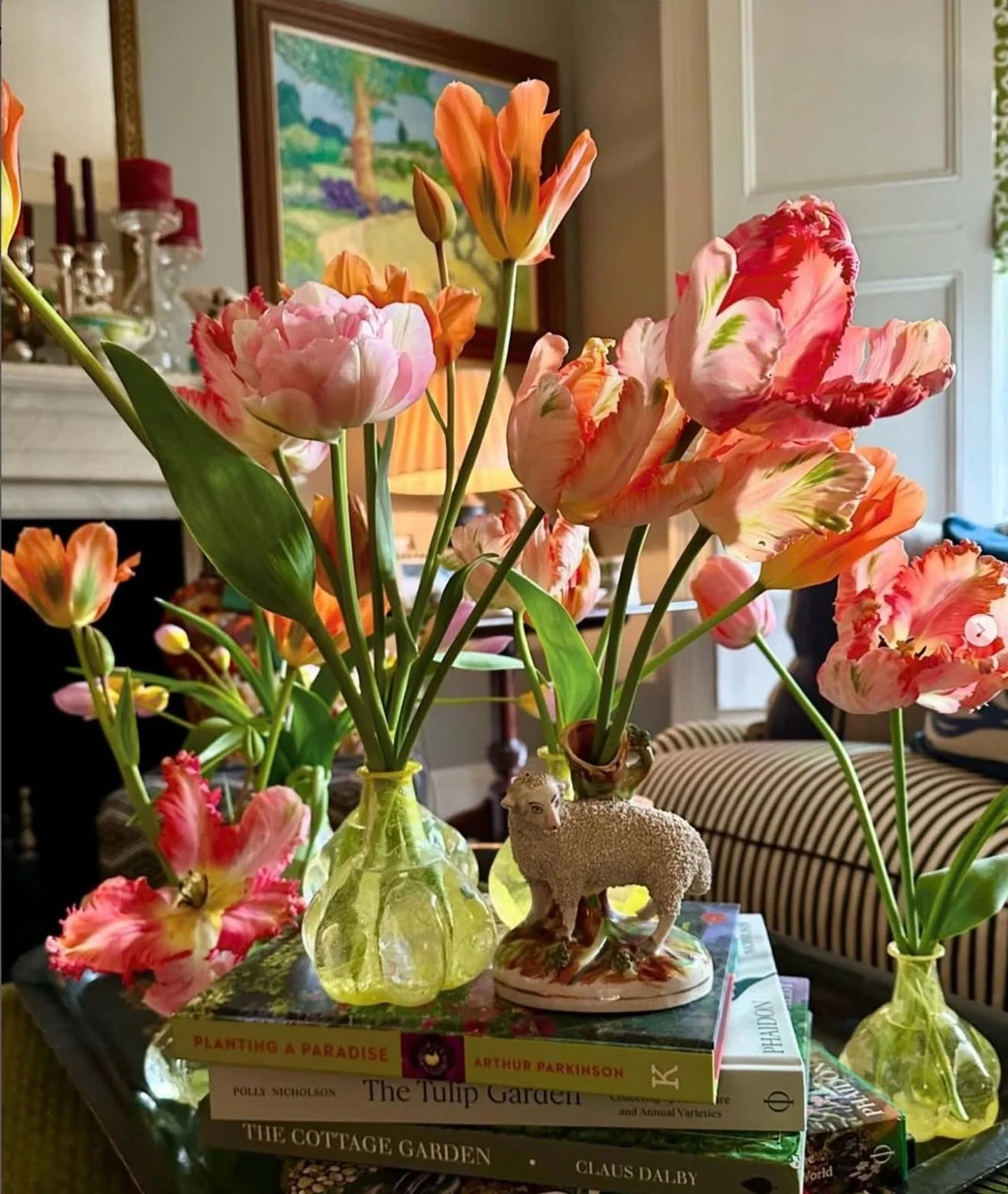 C L A S S I C
a lesson in living beautifully, from one of House &amp; Garden&rsquo;s Top 50 garden designers, Butter Wakefield.

This vignette captures spring in bloom with tulips in delicate glass vessels, stacked garden books, and a tiny lamb detai