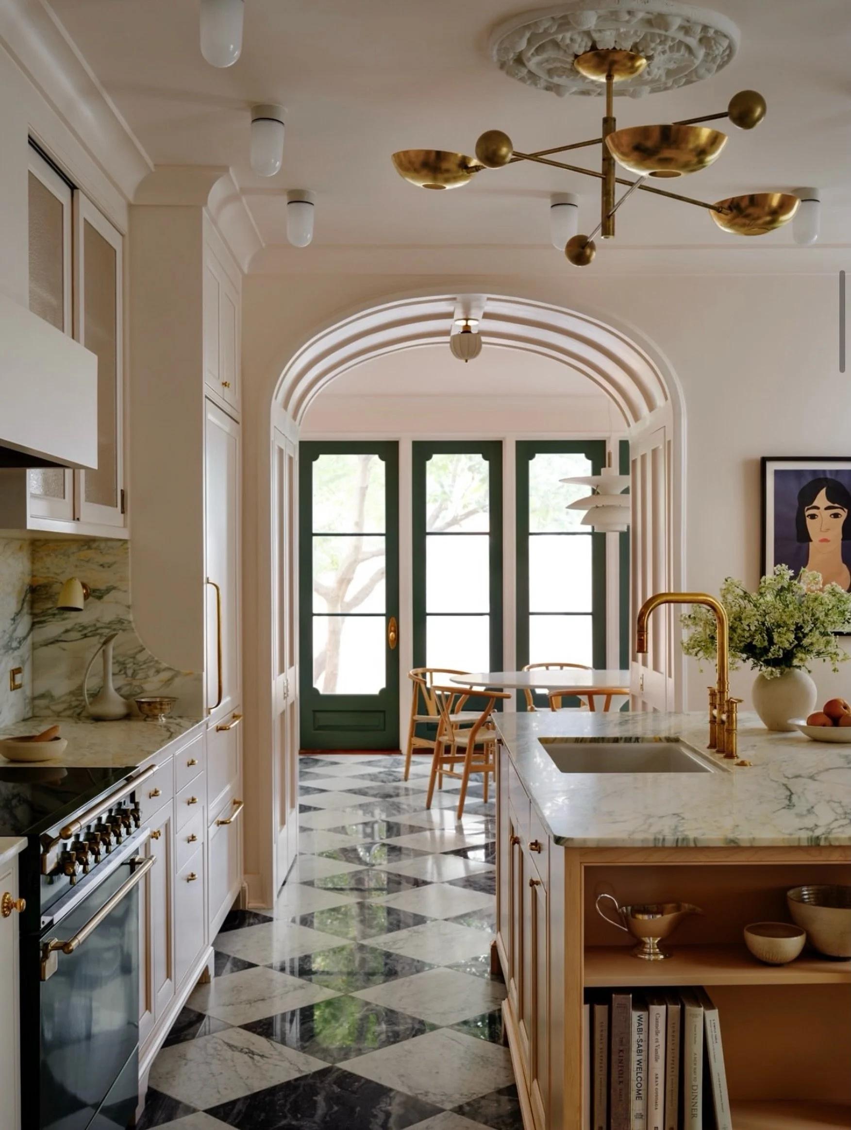 C L A S S I C
A kitchen where every detail feels considered, from the sculptural brass lighting to the &ldquo;barely there pink&rdquo; walls paired with a classic checkerboard floor.◼️◻️

Design by @nicholasgpotts ✨

#ClassicAndCurious
#InteriorDesig