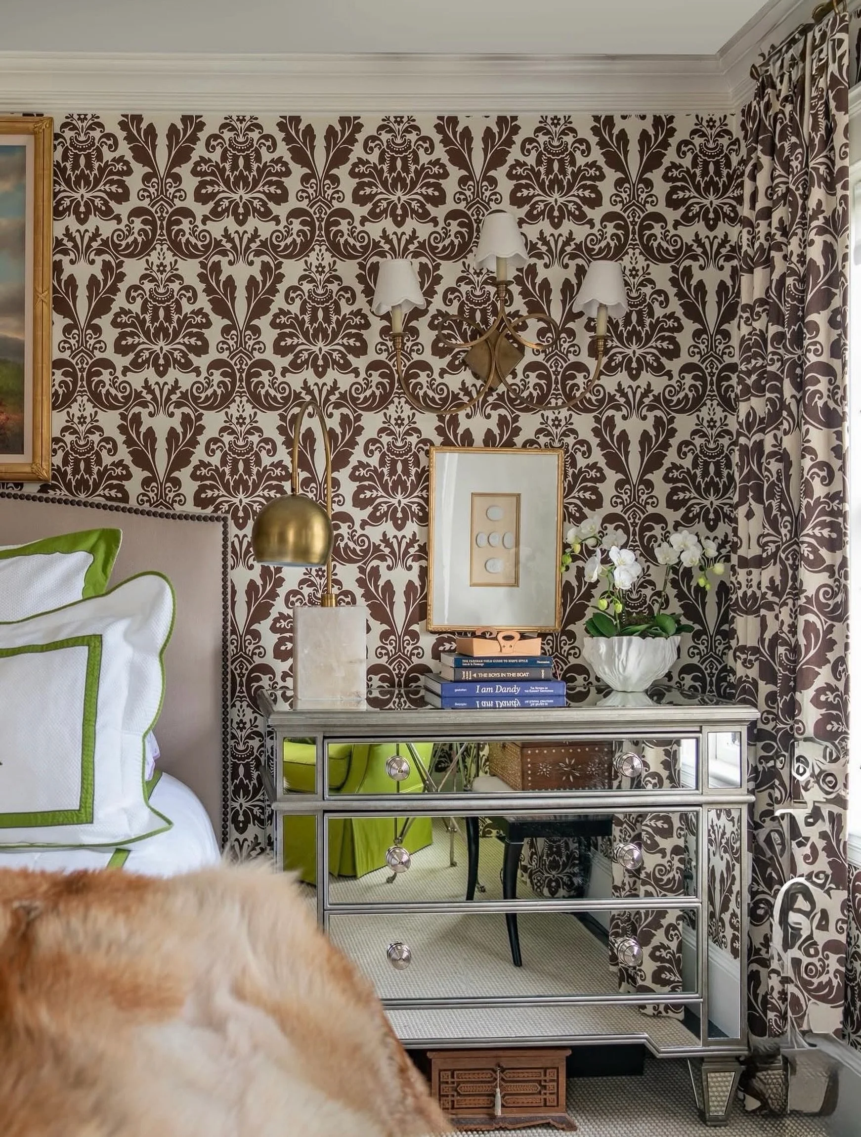 D R A M A T I C
Patterned walls, a mirrored chest, and a fresh pop of green. Throw in a little fur, draped for a touch of glamour. ✨

A room that knows how to make an entrance, then invites you to stay in.🤎

Design &amp; 📸 via @lizcaan

#ClassicAnd