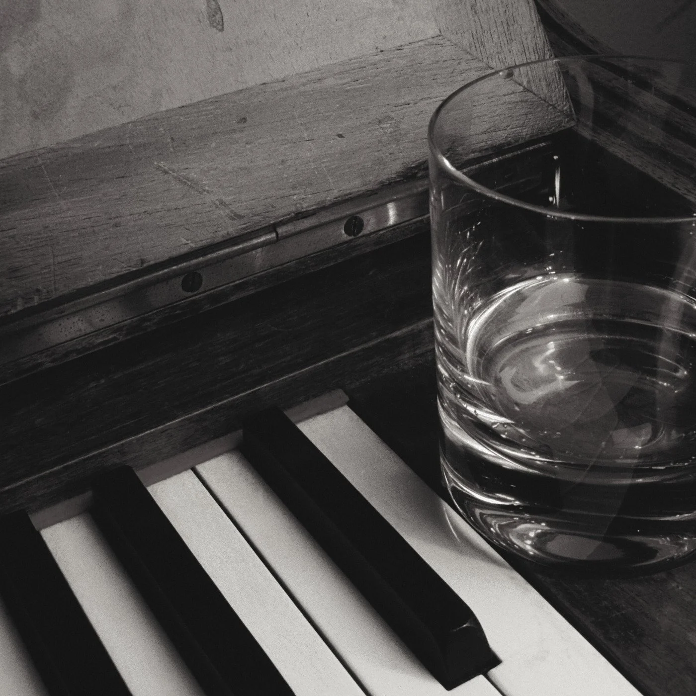 cocktail sitting on piano keys