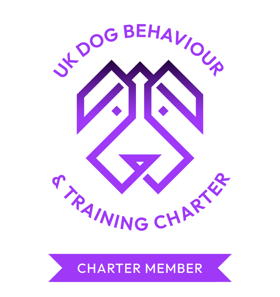 Purple logo for UK Dog Behaviour & Training Charter featuring a stylized dog's face within a circular design, with the text 'UK Dog Behaviour & Training Charter' at the top and 'Charter Member' at the bottom on a purple banner.