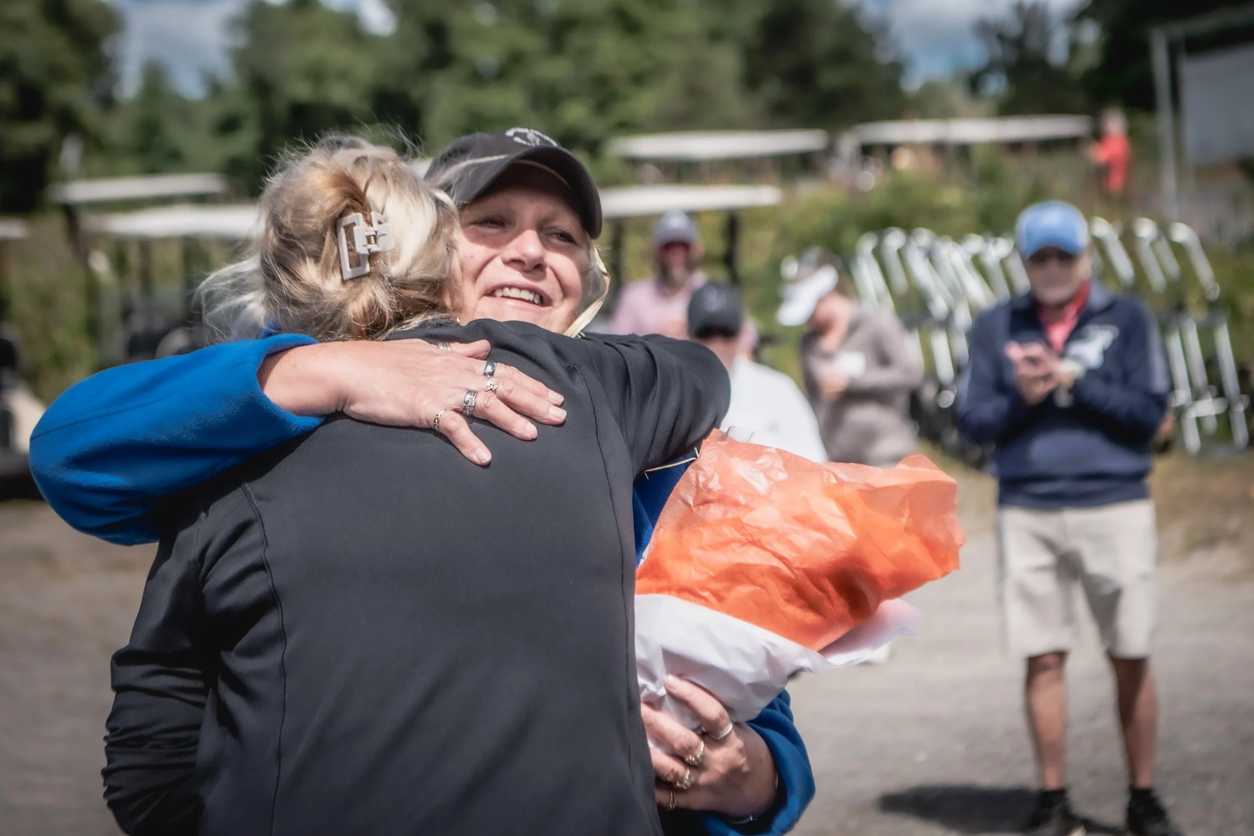 Lunenburg Business Association presenting flowers to the owner of Settlers Crossing Golf Course in appreciation of their support as host of the LBA charity golf tournament.