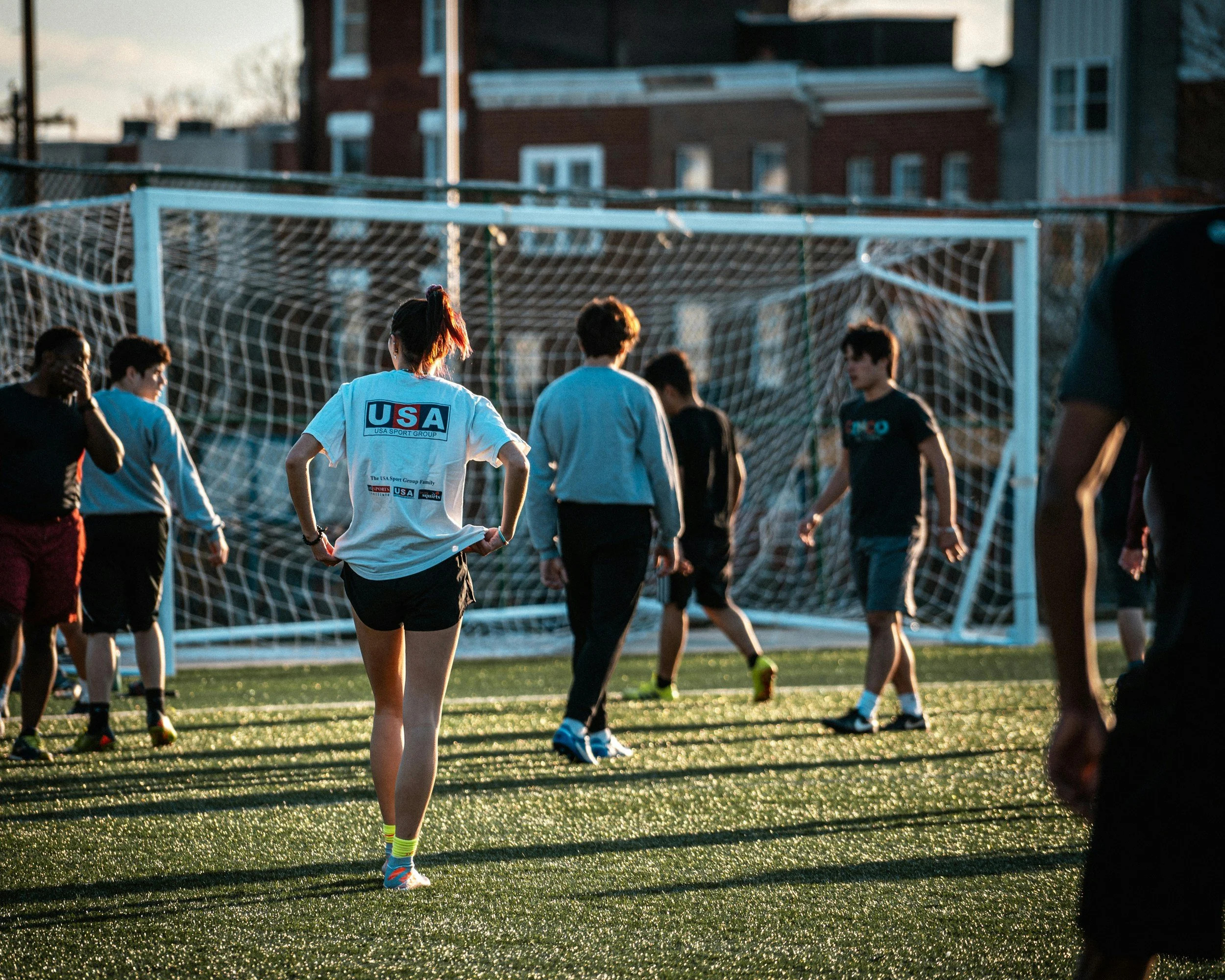 Group of soccer players train in group session