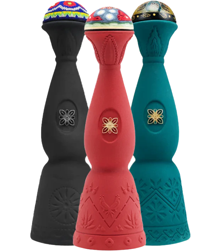 Three decorative golf club covers in black, red, and teal, each with embroidered and embossed patterns, topped with colorful, decorative fabric covers.
