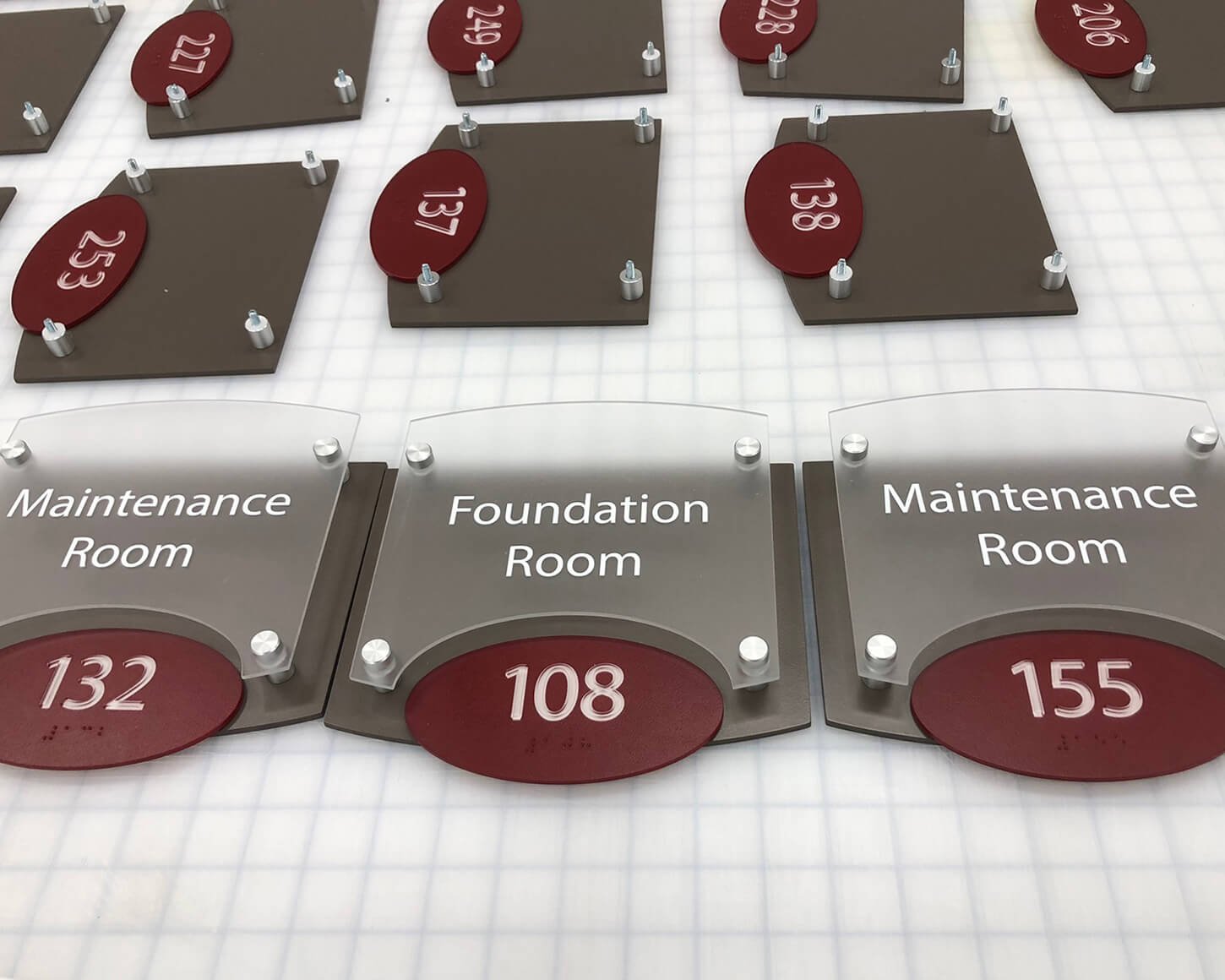 Room directory signs with room numbers and labels such as Maintenance Room and Foundation Room.