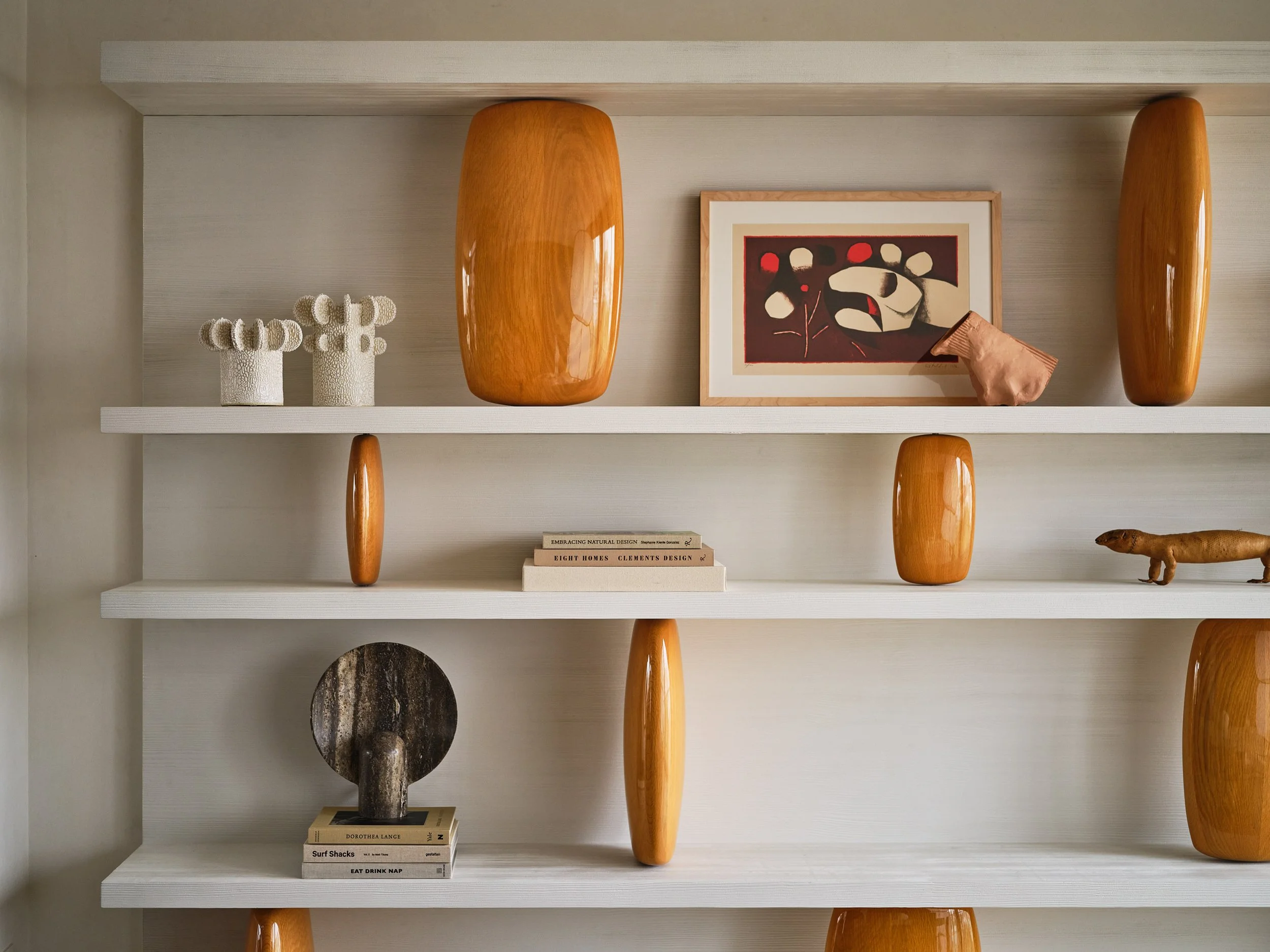 Broadway Penthouse Pacific Heights built in shelving styled with decorative vases, framed art, books, and a small figurine, showing curated modern luxury interior styling in San Francisco.