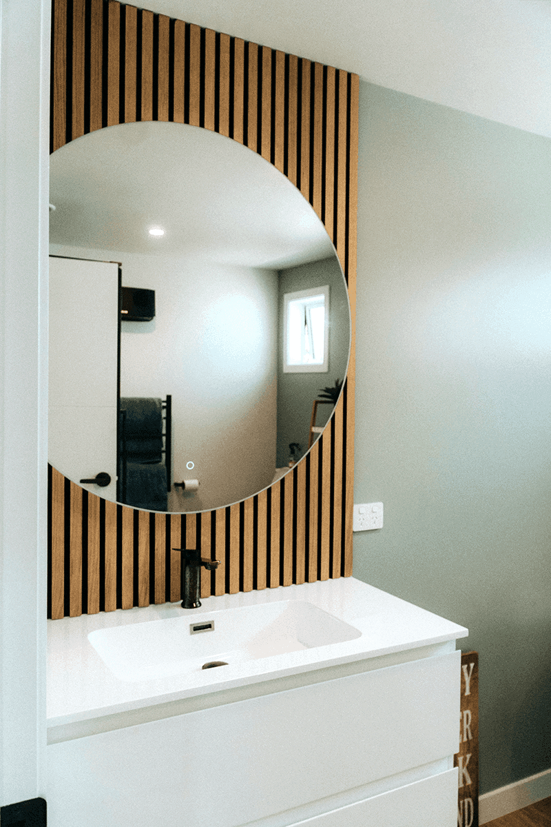 Bathroom with vanity mirror.png