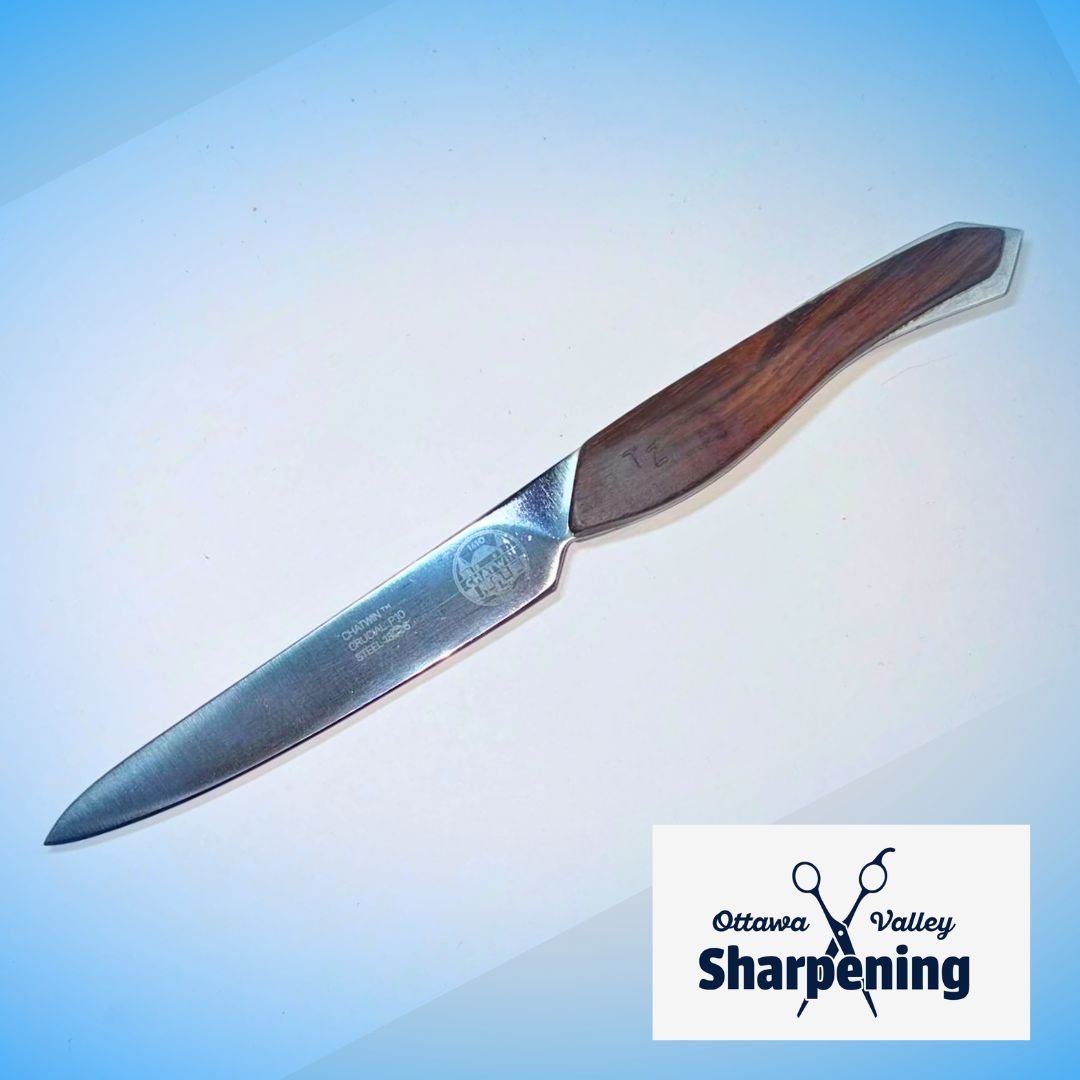 A sharpening steel with a wooden handle and a metal blade lying on a white surface, featuring the Ottawa Valley Sharpening logo.