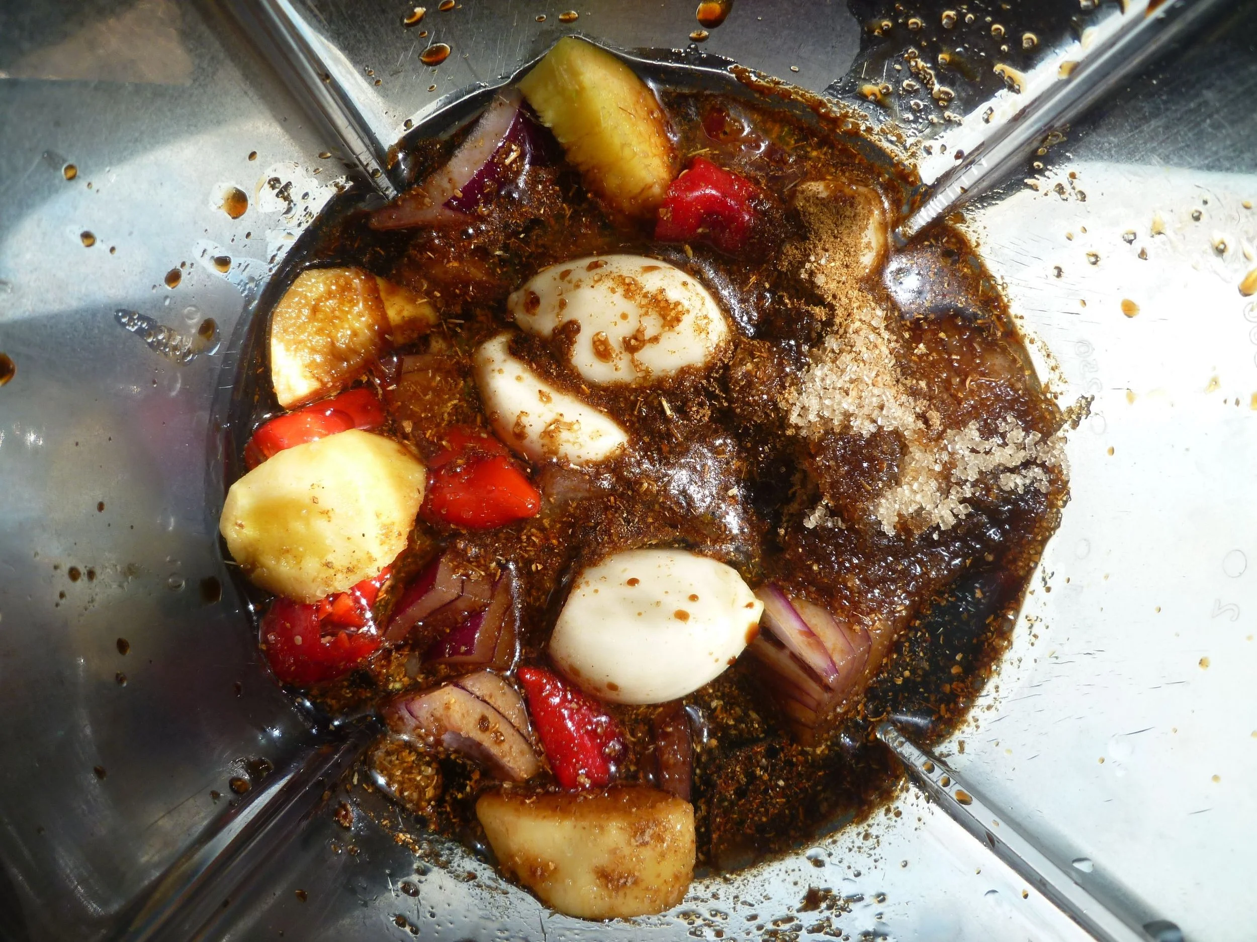 A blender containing ingredients like garlic, chilli and ginger to make a Thai style curry sauce mix.