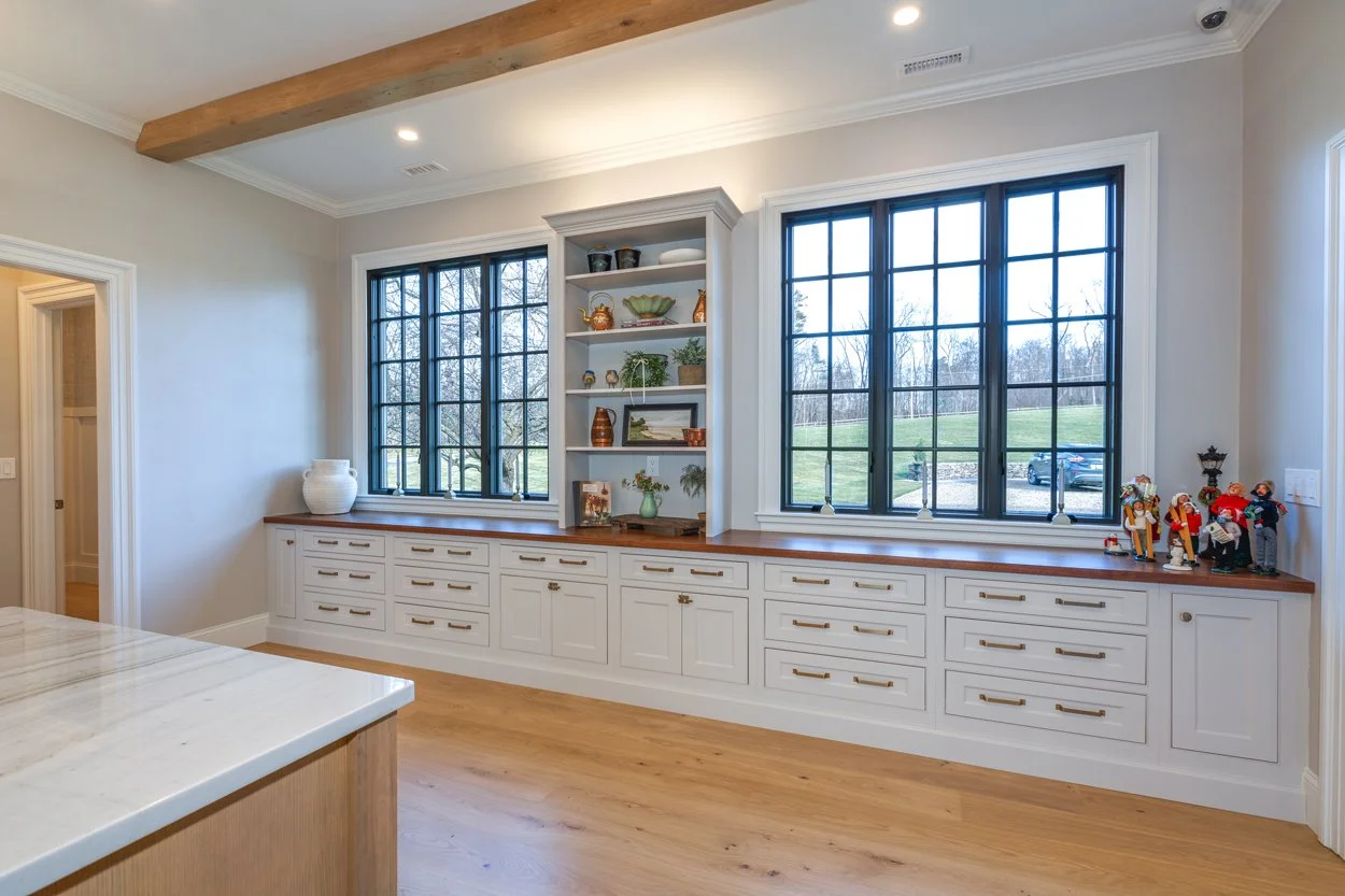 custom white shaker cabinetry with brass hardware installed by contractor using Builder's Reserve finishes New Hampshire