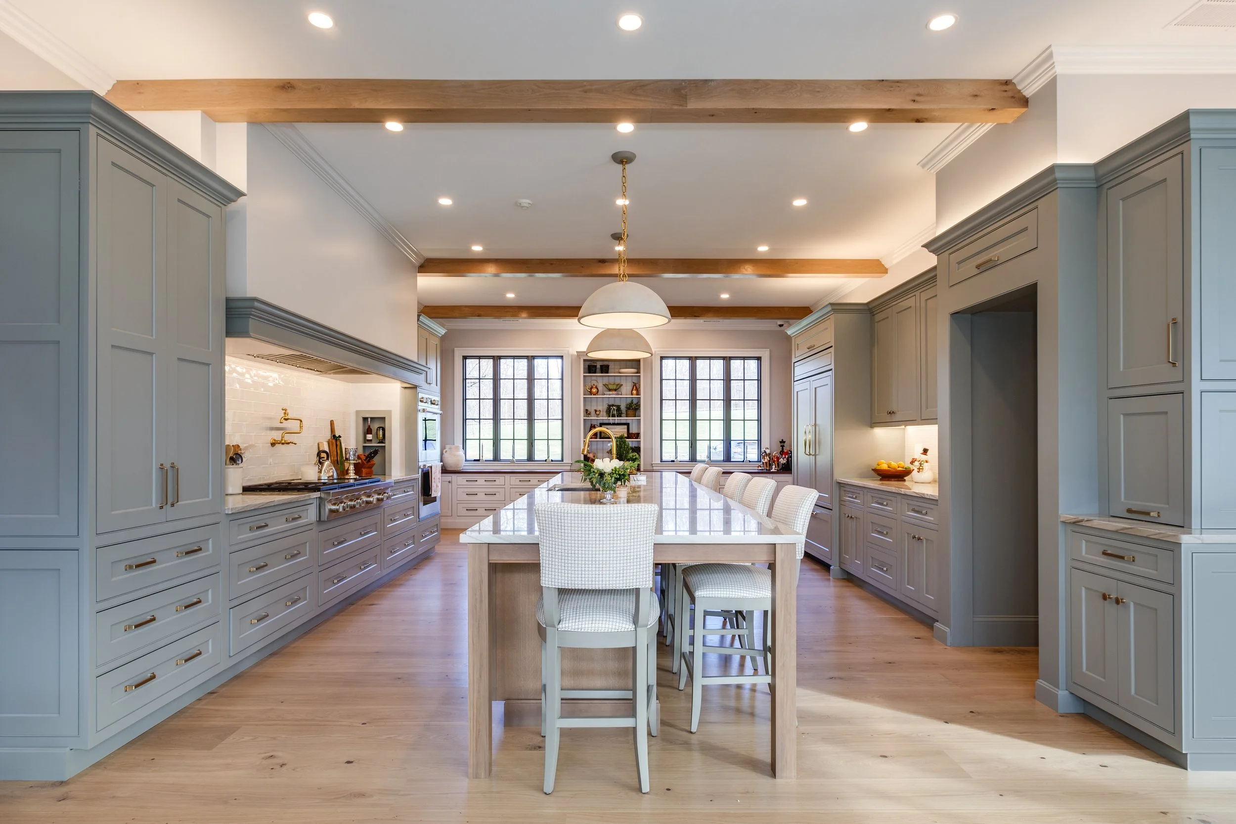 Custom kitchen island Sherwin-Williams designer color painted cabinets wood beam ceiling white countertops Topsfield MA addition