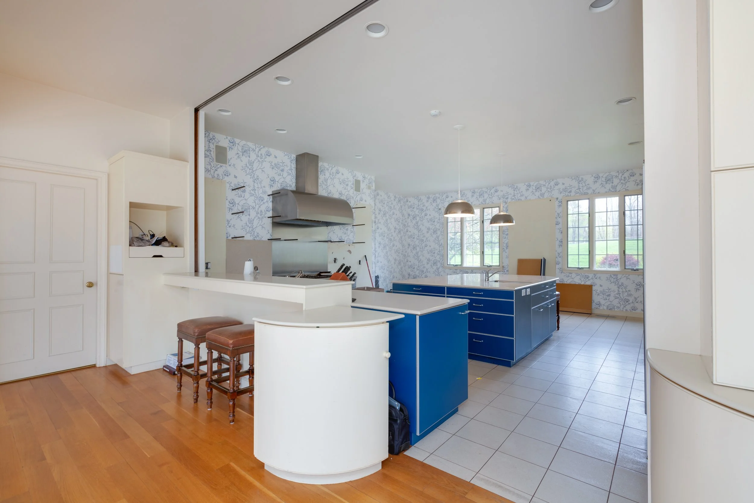 Kitchen before renovation blue island white cabinets tile floor Topsfield Massachusetts