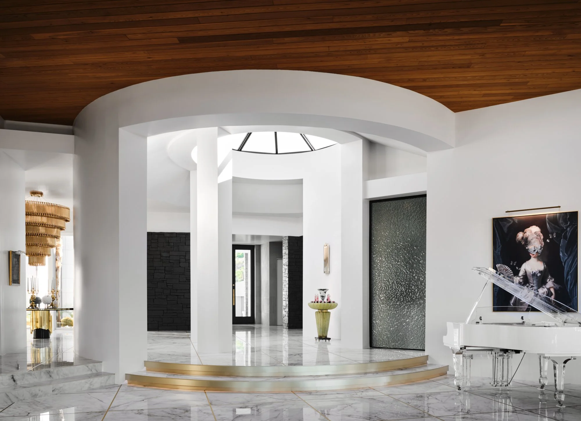 Luxurious modern interior with white curved walls, marble flooring, a white grand piano, and decorative artwork.