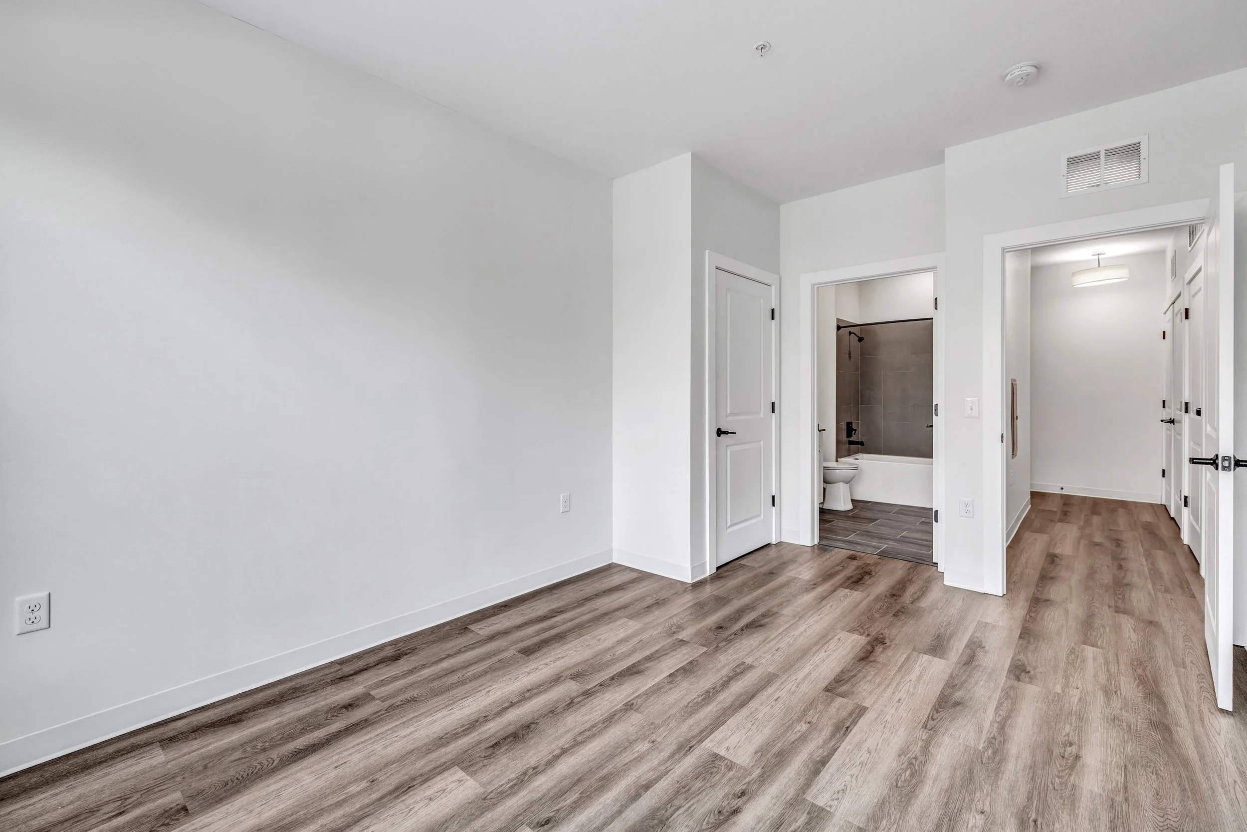 Large Bedroom with Natural Light and Bathroom Adjacent