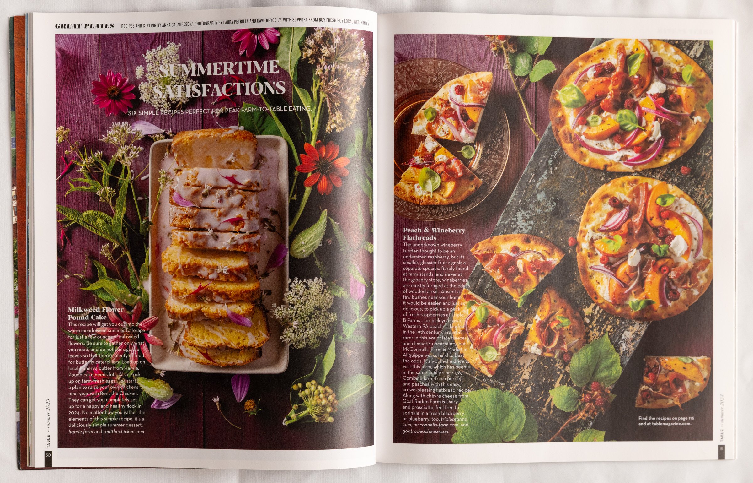 Open magazine spread featuring summer recipes, including milkweed flower pound cake on the left and peach and wineberry flatbreads on the right, with vibrant flowers and greenery in the background.