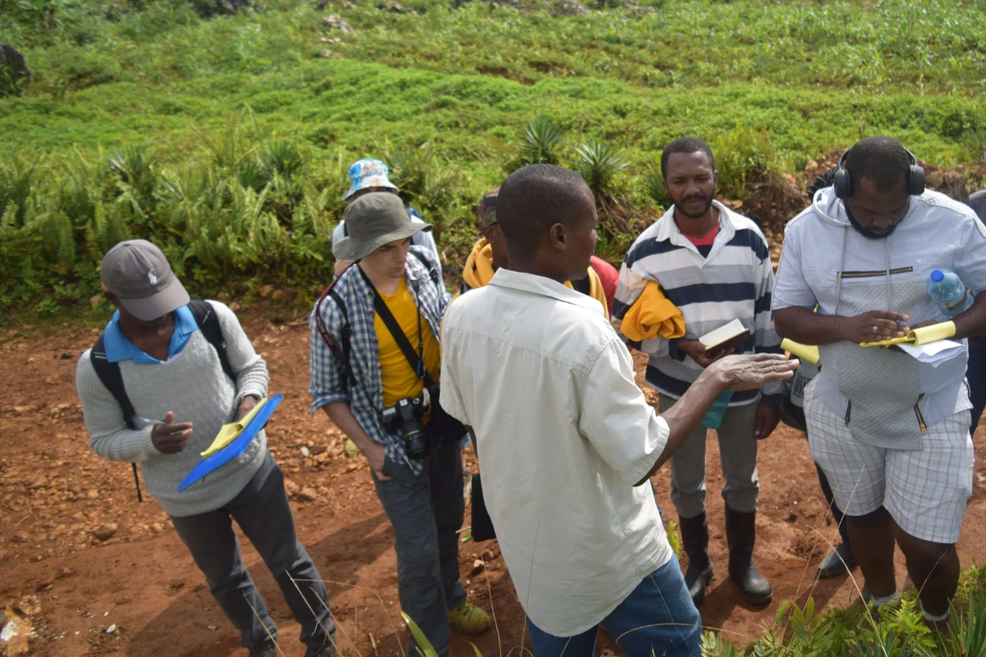 a group of people are led on a field trip. to learn about nature