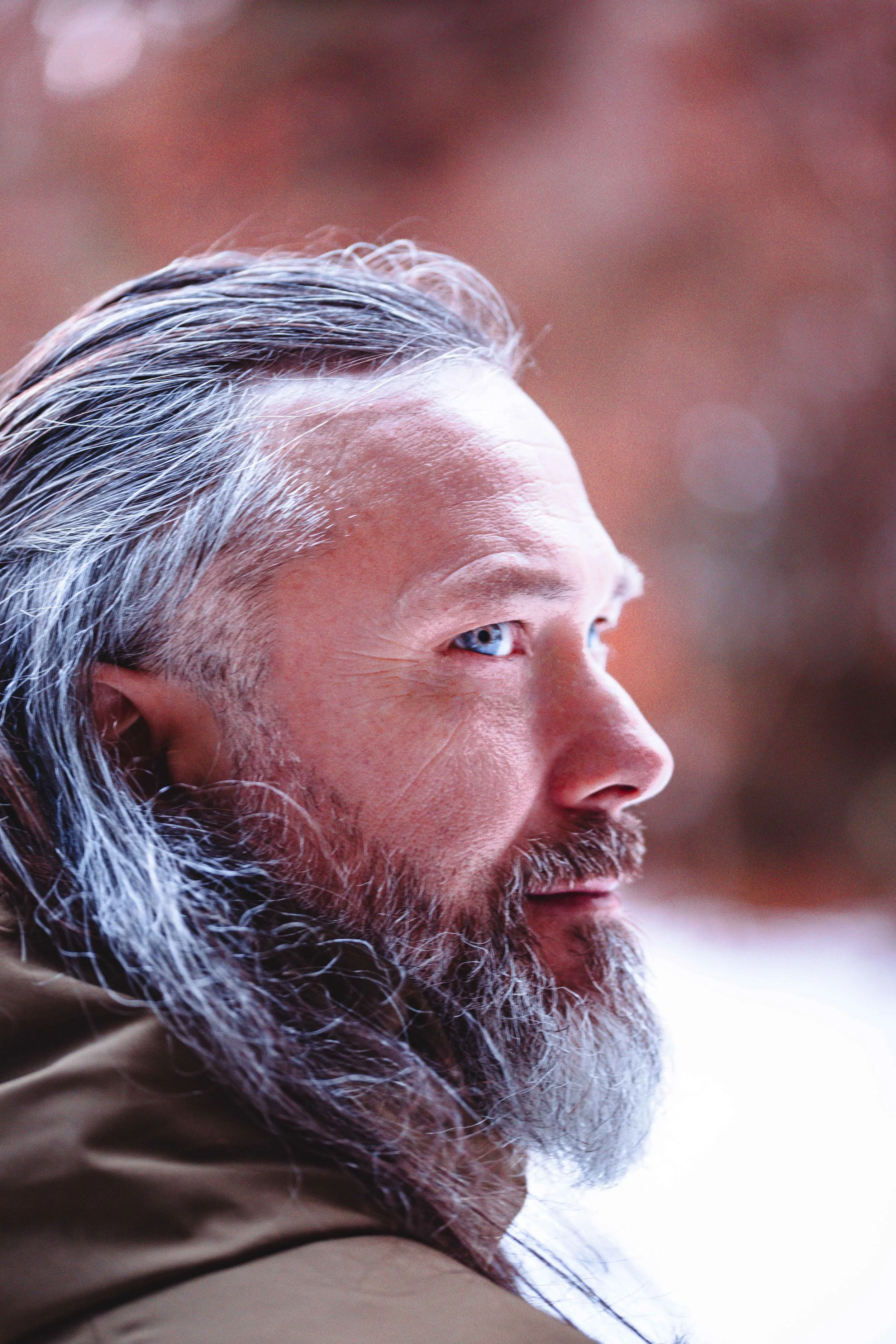 a beautiful scandinavian man with beard and blue eyes